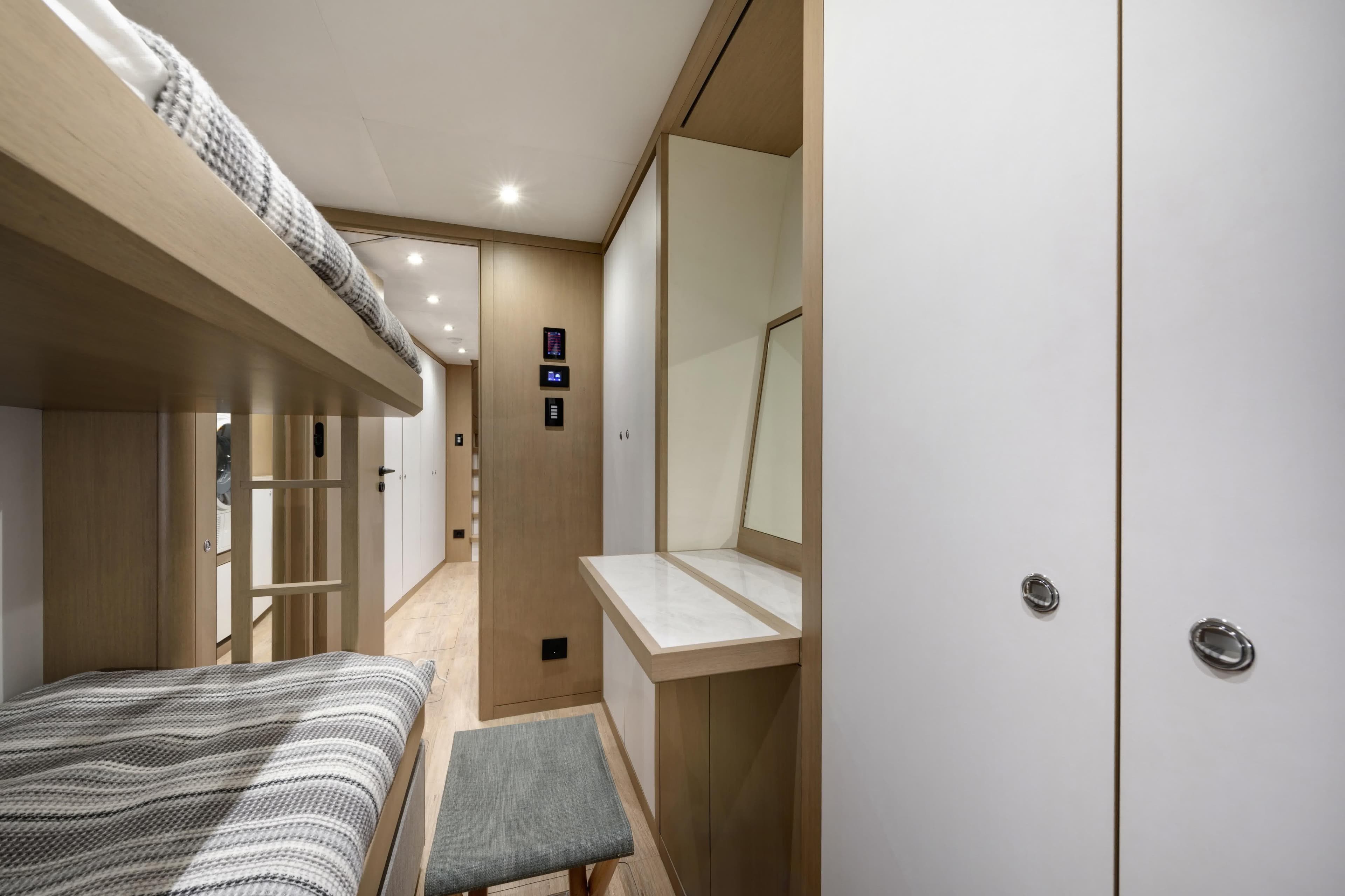 Interior of 2027 Lazzara LPC 300 yacht with bunk beds and modern design.