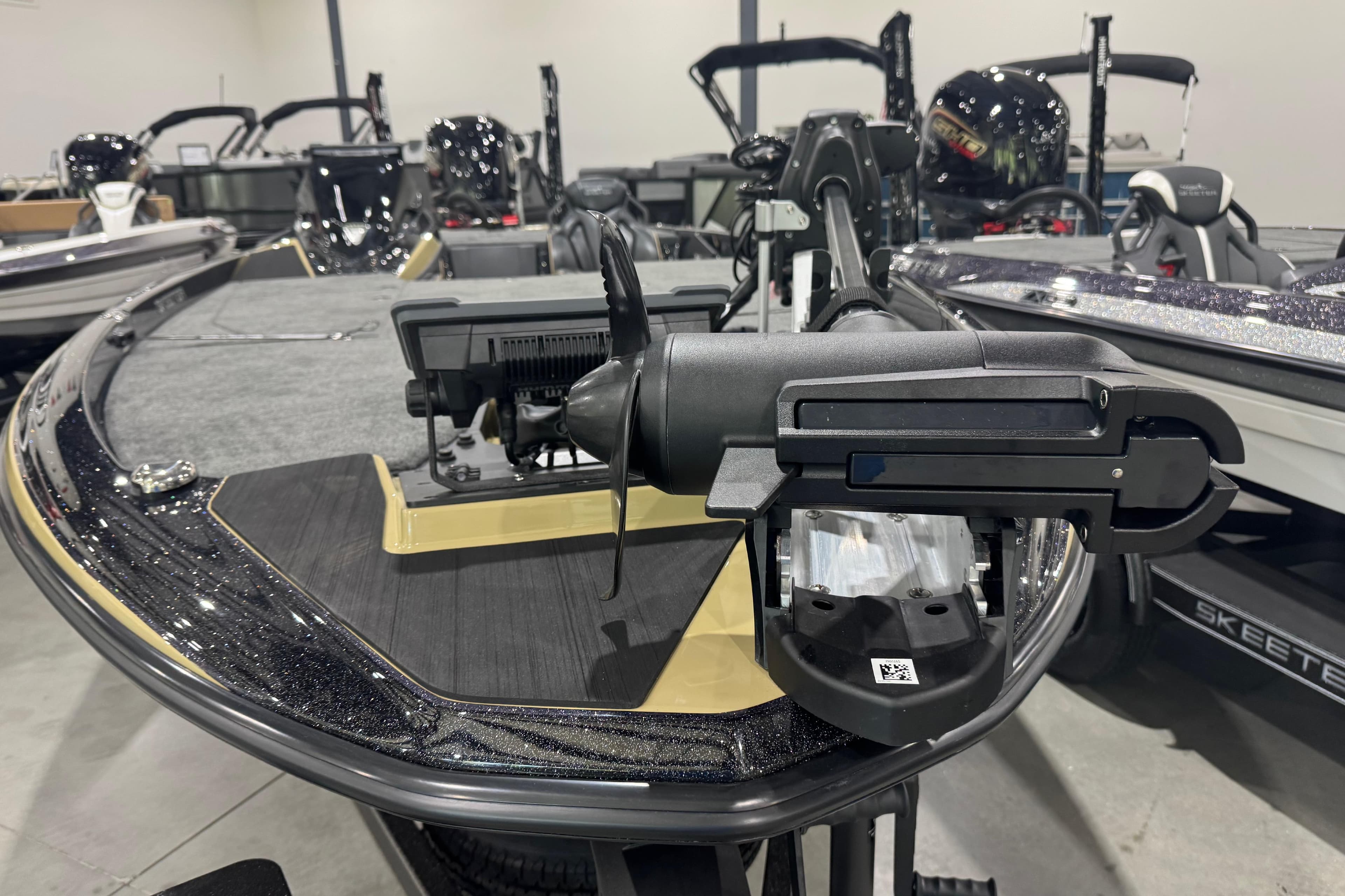 2026 Skeeter ZXE20 boat with advanced trolling motor in showroom.