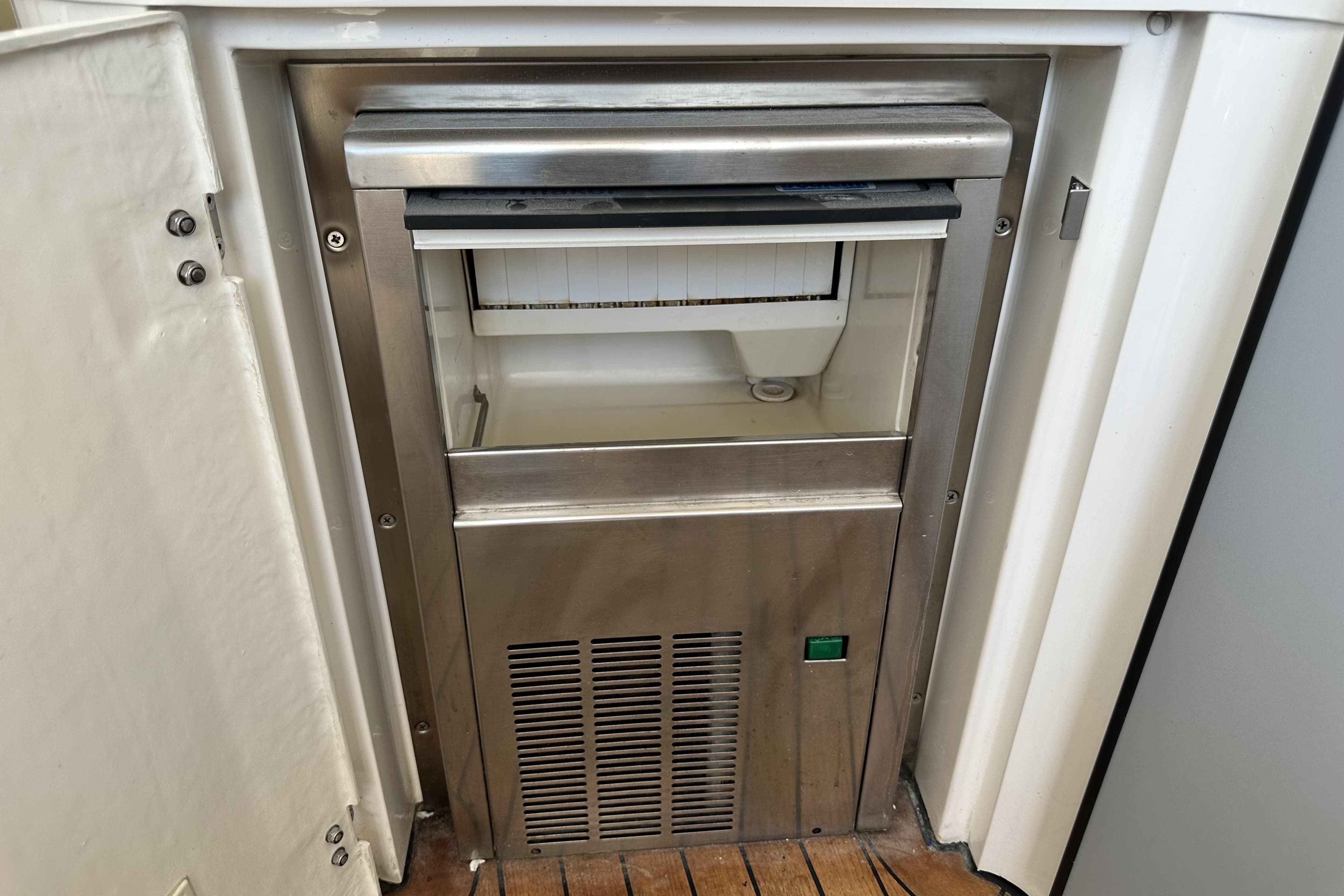 Built-in ice maker on 2004 Fairline Targa 62 yacht, stainless steel finish.