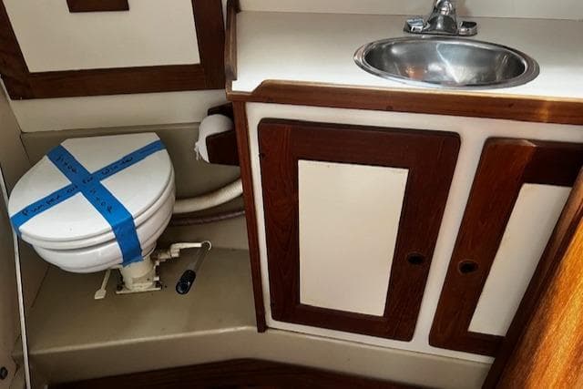 1980 CAL 39 MK II Sloop bathroom with sink and taped toilet.