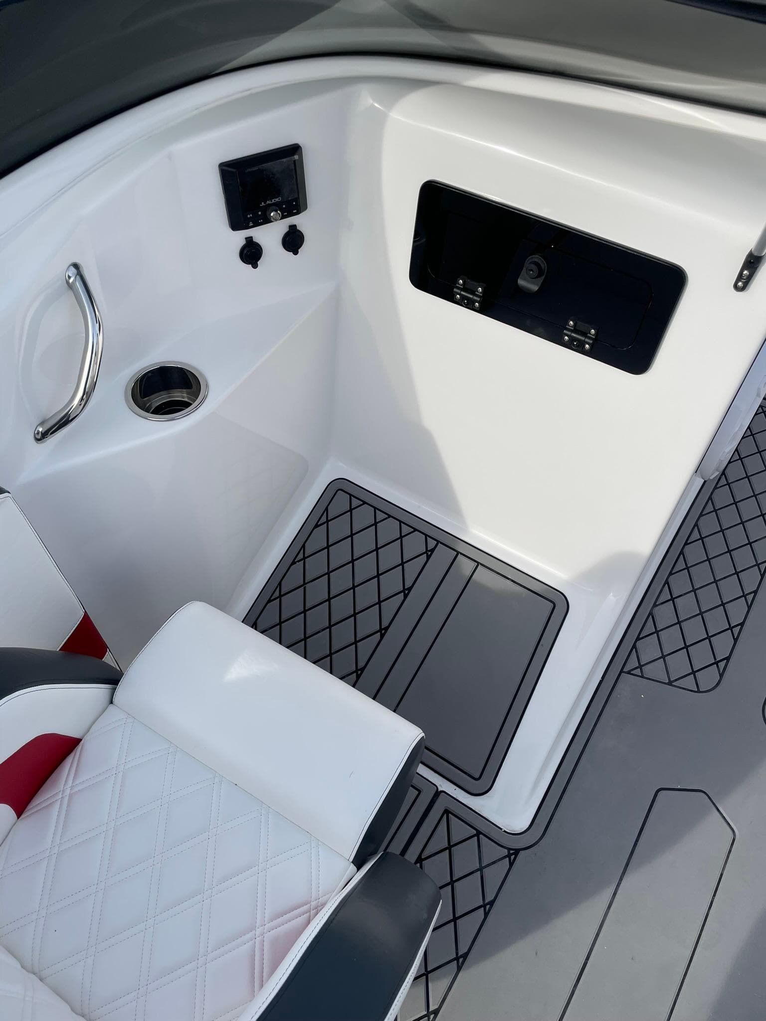 2025 Checkmate Pulsare 2400 BRX boat interior with modern seating and control panel.