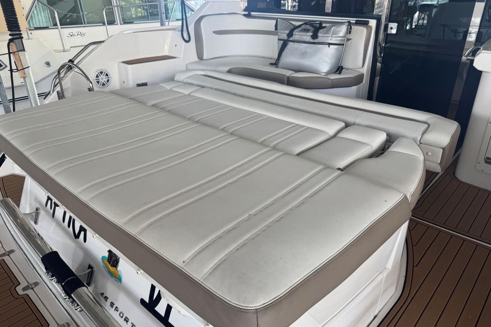 2016 Regal 46 Sport Coupe yacht with spacious white leather seating area.
