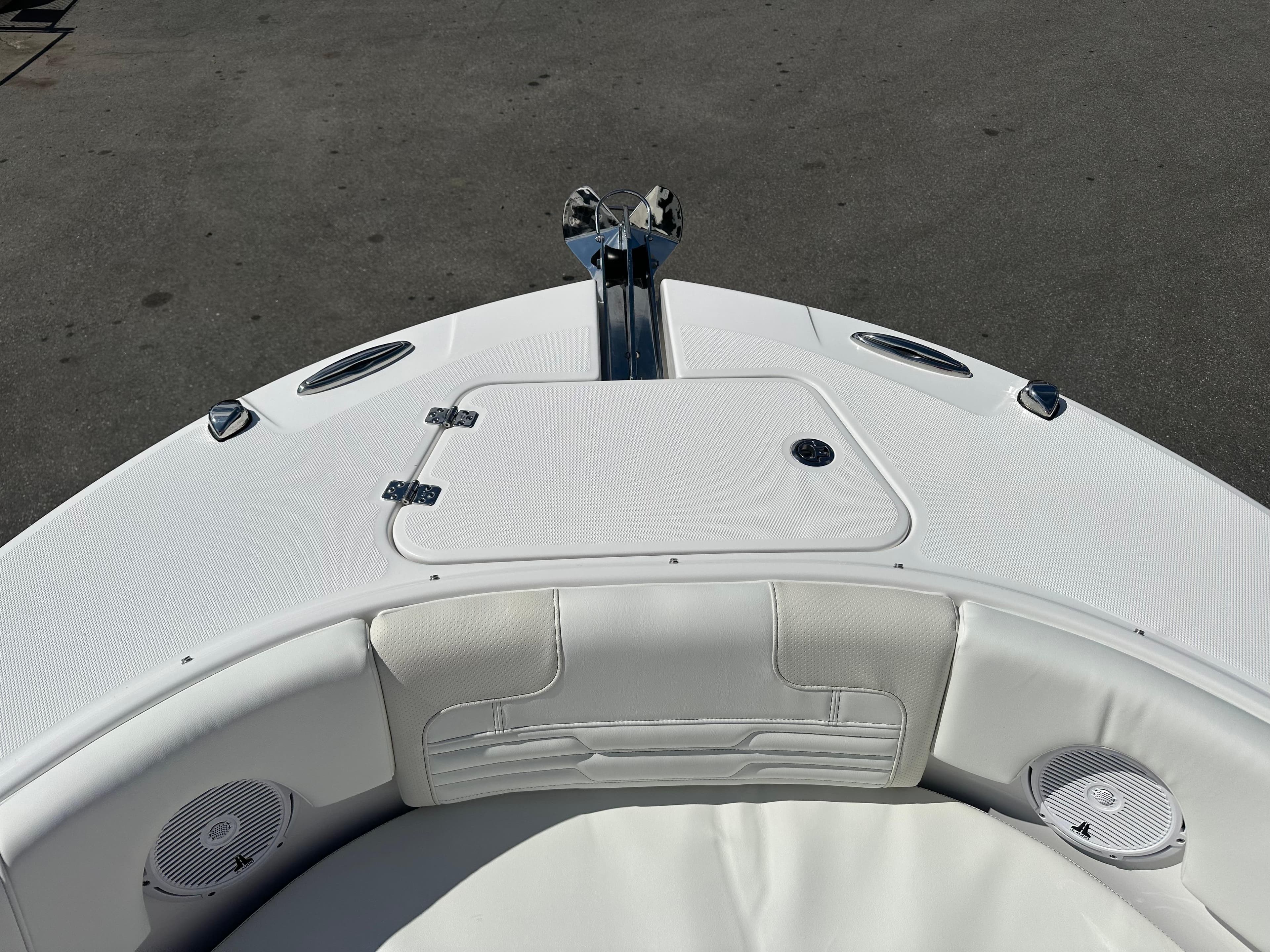 2025 Edgewater 248CX Crossover boat bow with white seating and anchor.