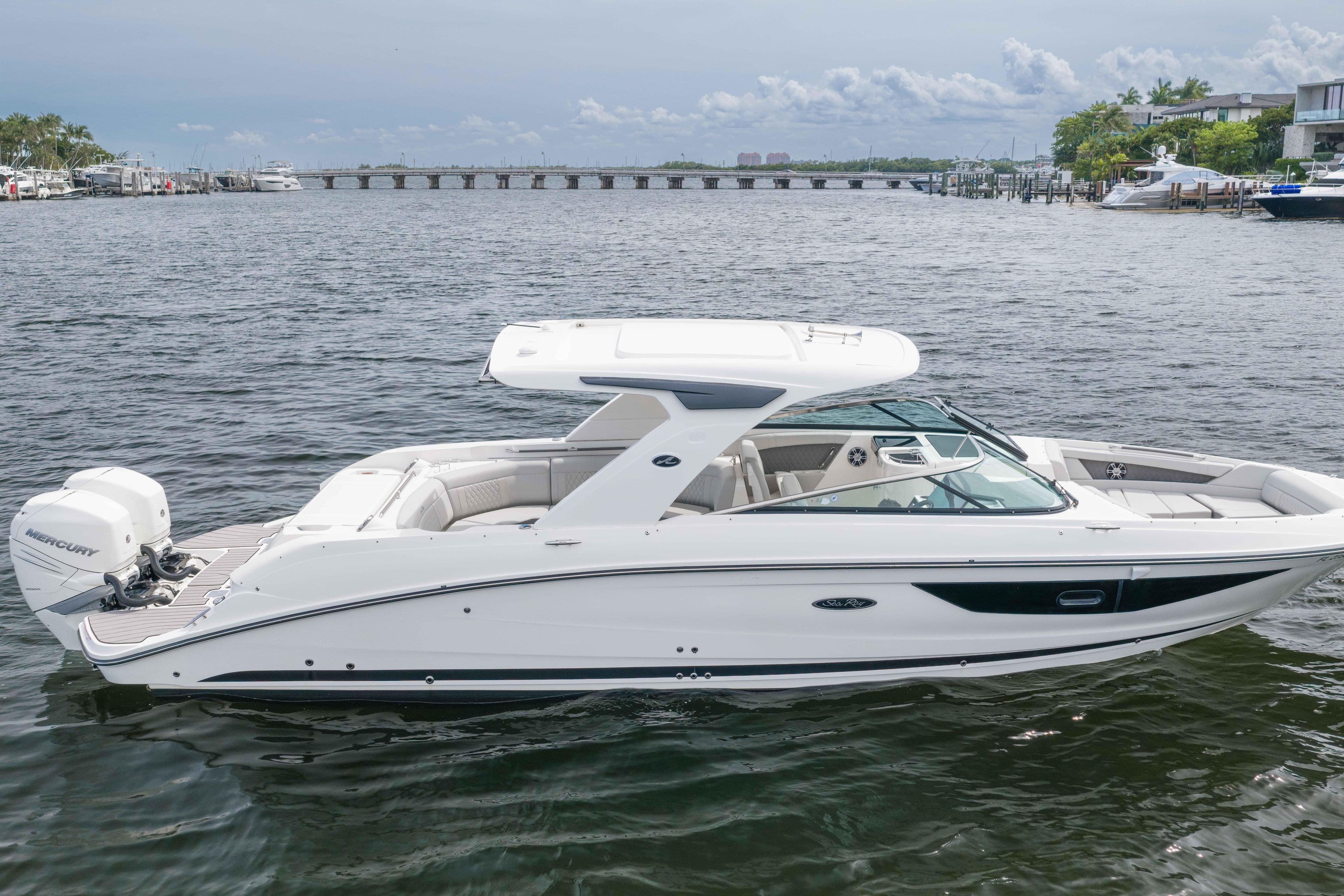 2023 Sea Ray SLX 350 Outboard boat on calm water, showcasing sleek design and luxury features.