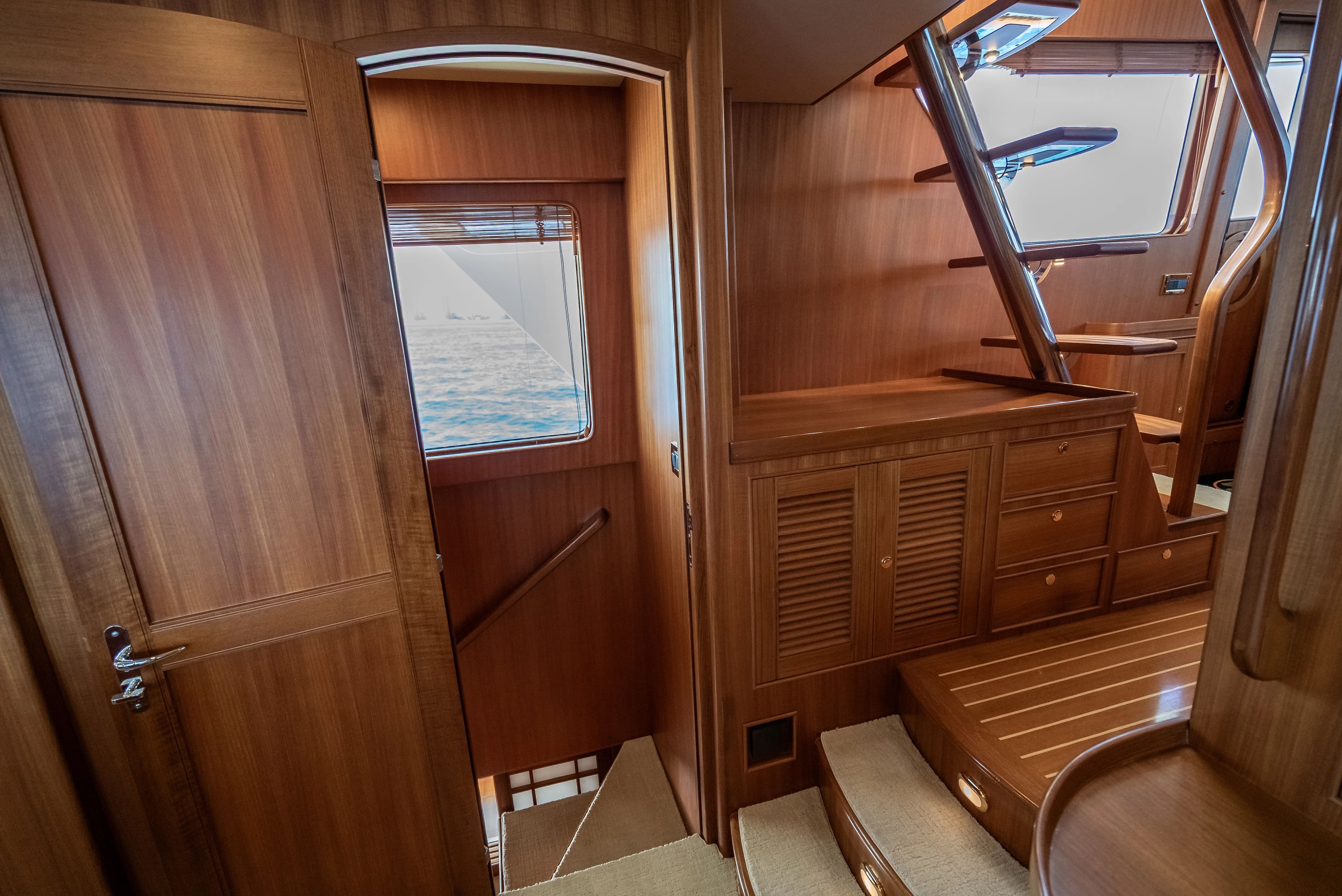 Interior of a 2011 Marlow Explorer yacht with wooden paneling.