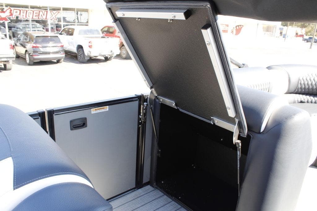 2026 Avalon Catalina Cruise Rear Bench storage compartment open, showcasing interior space.