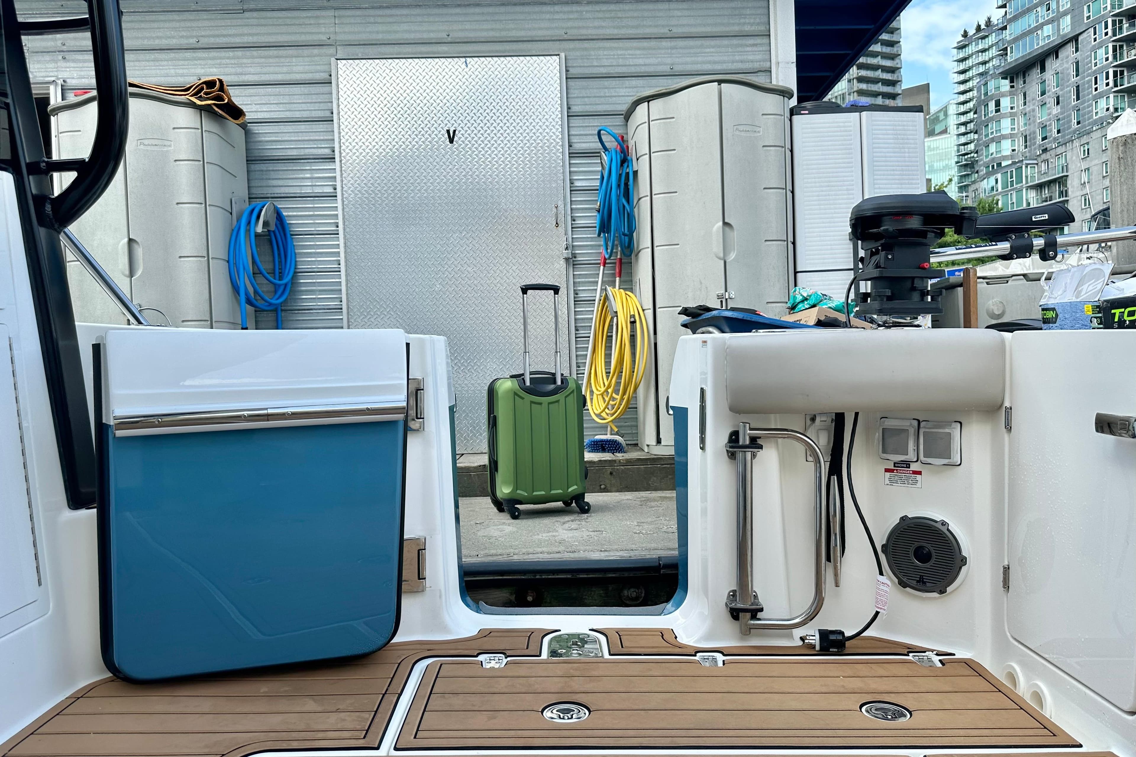 2025 Boston Whaler 365 Pilot House boat interior with dockside view and equipment.