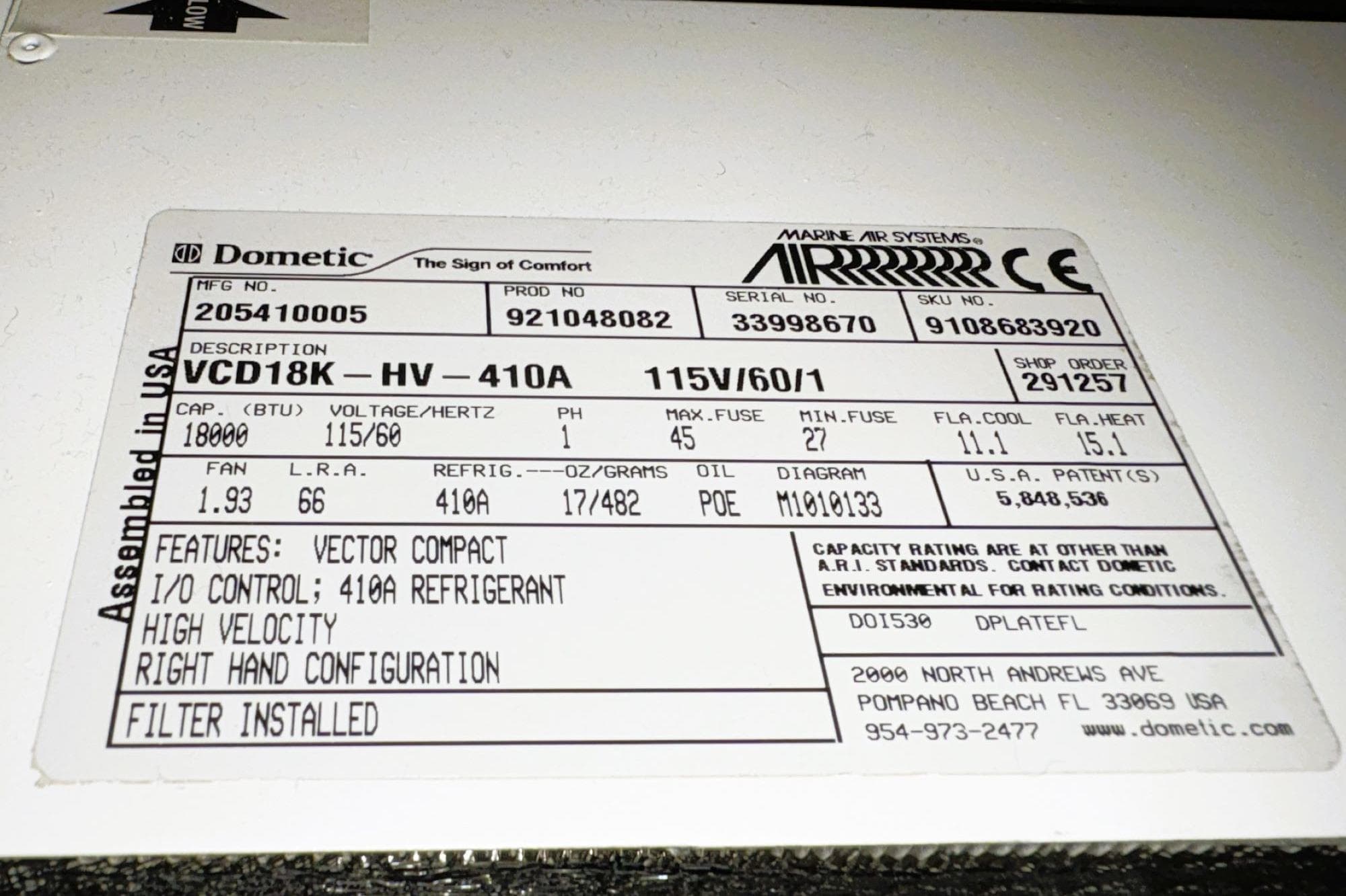 Label on Dometic marine air system, model VCD18K-HV-410A, 115V, 18000 BTU, 410A refrigerant.