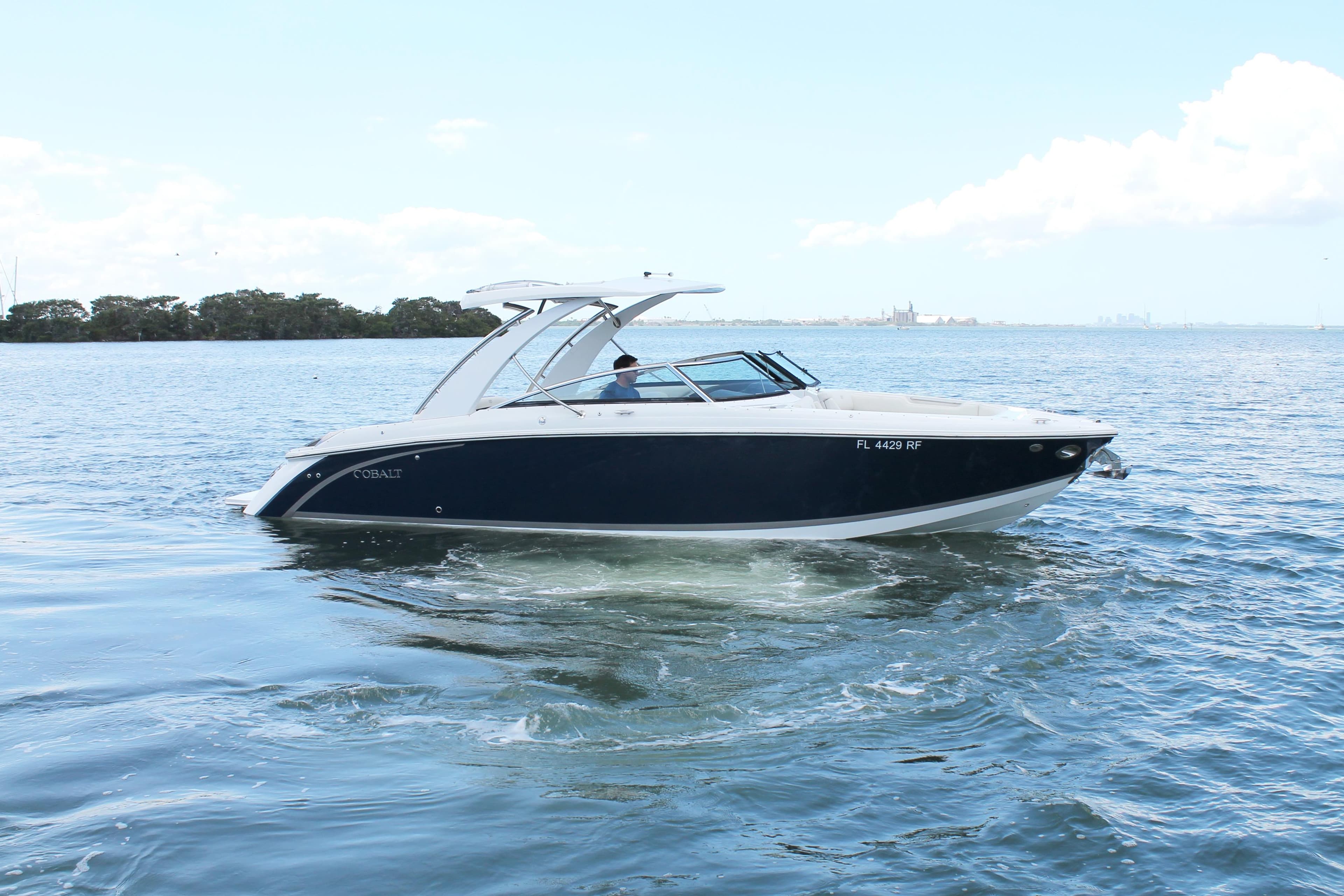 2017 Cobalt R30 boat cruising on open water under clear skies.