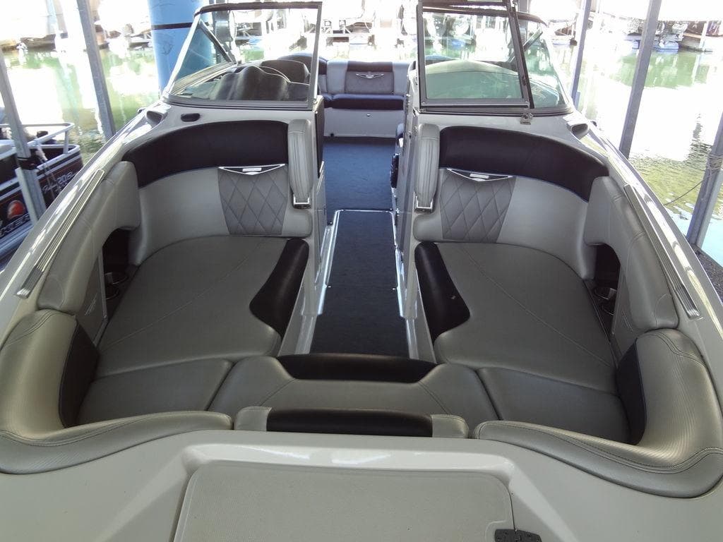 2013 MasterCraft X55 boat interior with gray and black seating.
