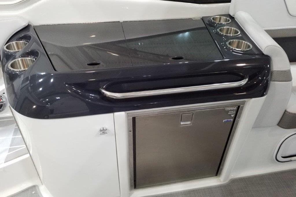 2021 Formula 350 Sun Sport boat interior with sleek kitchenette and cup holders.