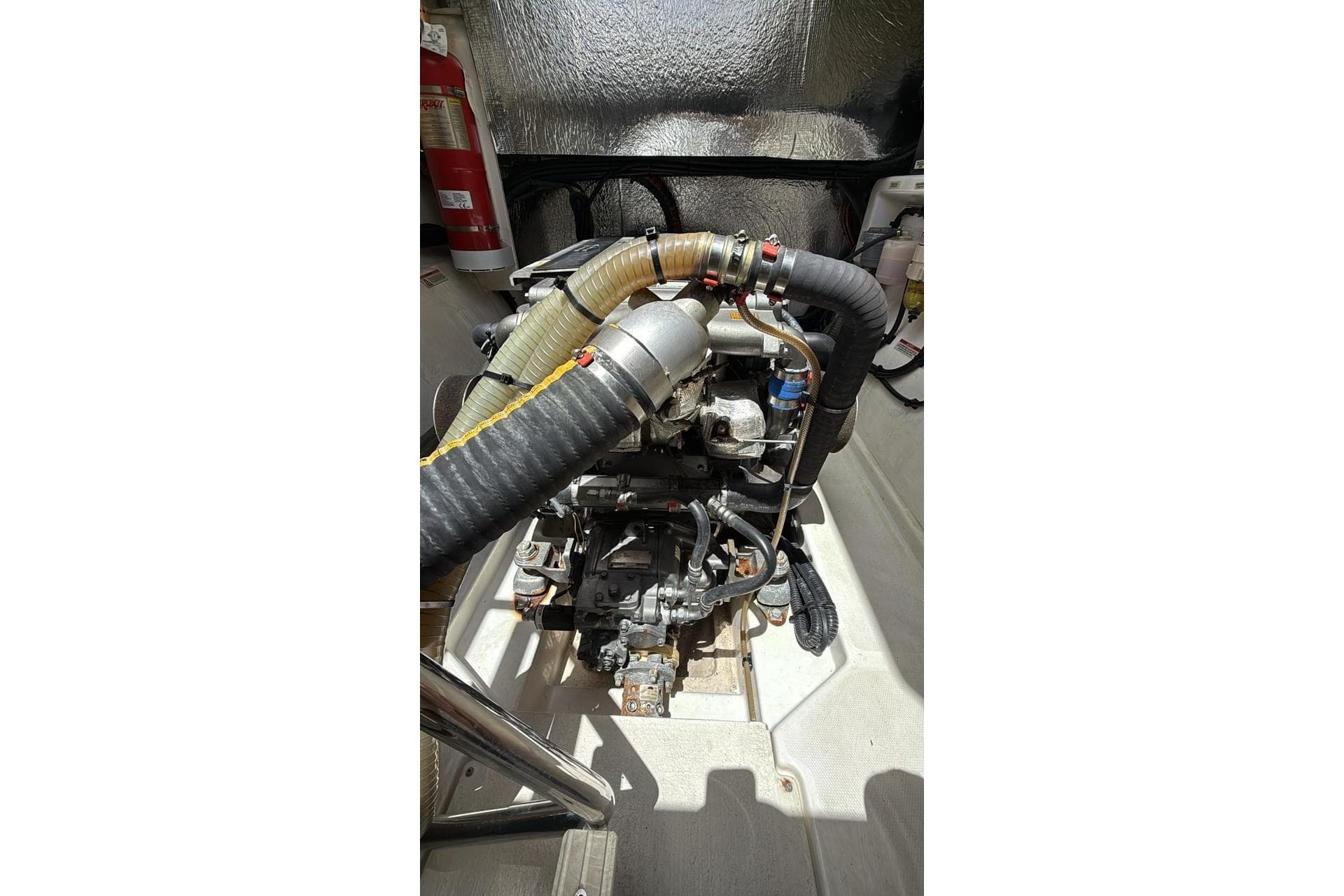 Engine compartment of a 2022 Leopard 53 Powercat with visible hoses and components.