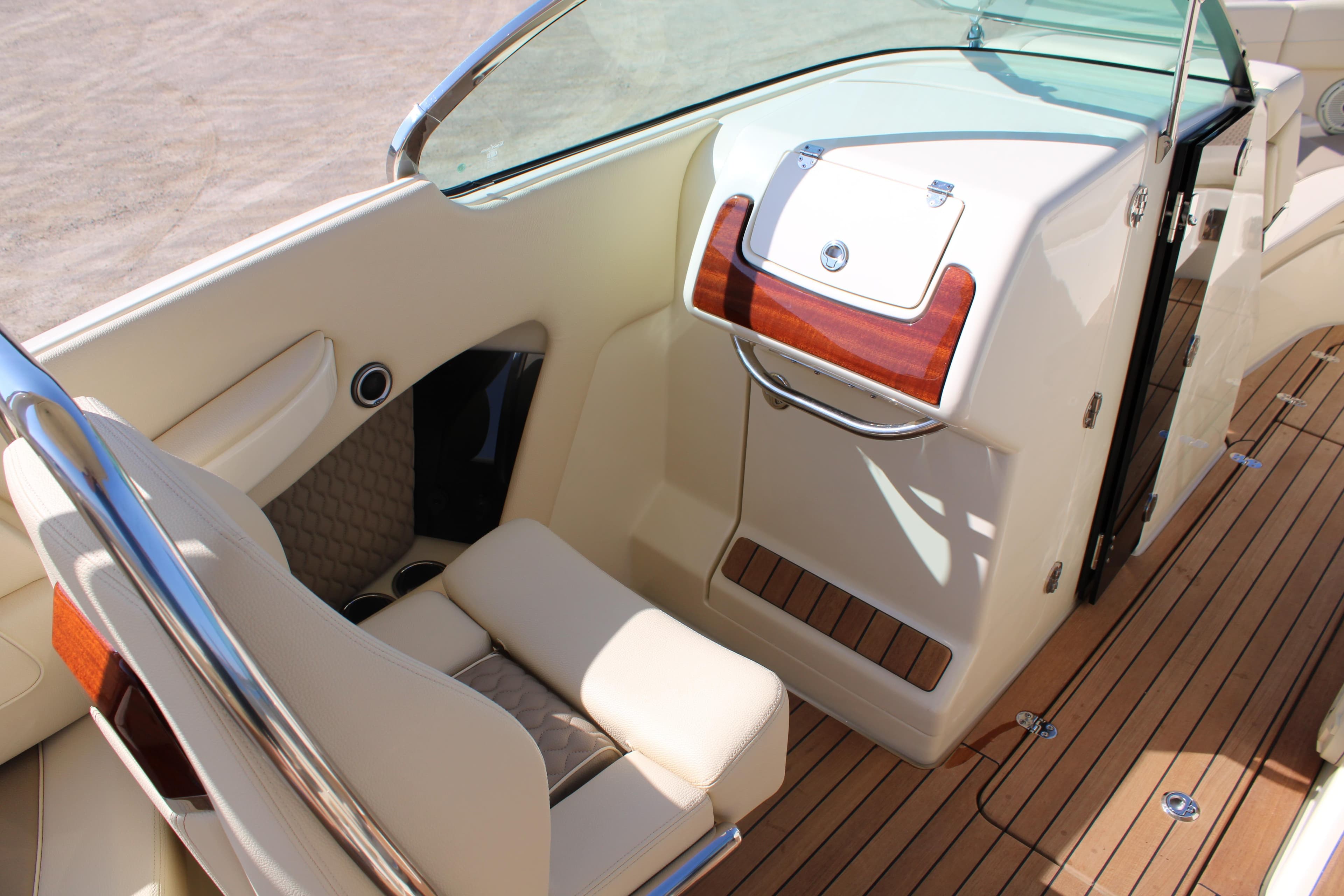 2025 Chris Craft Launch 28 GT interior with elegant seating and wood accents.
