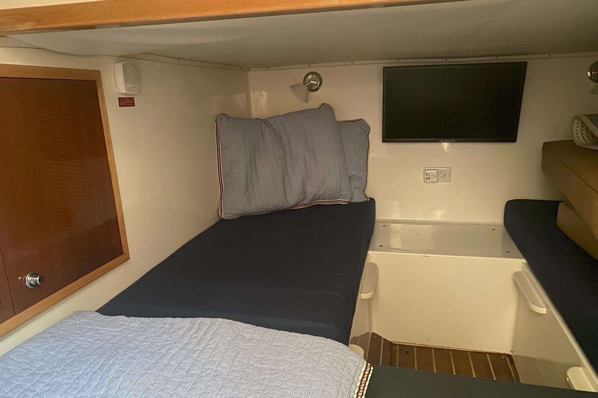 2008 Contender 38 Express cabin interior with twin beds and wall-mounted TV.
