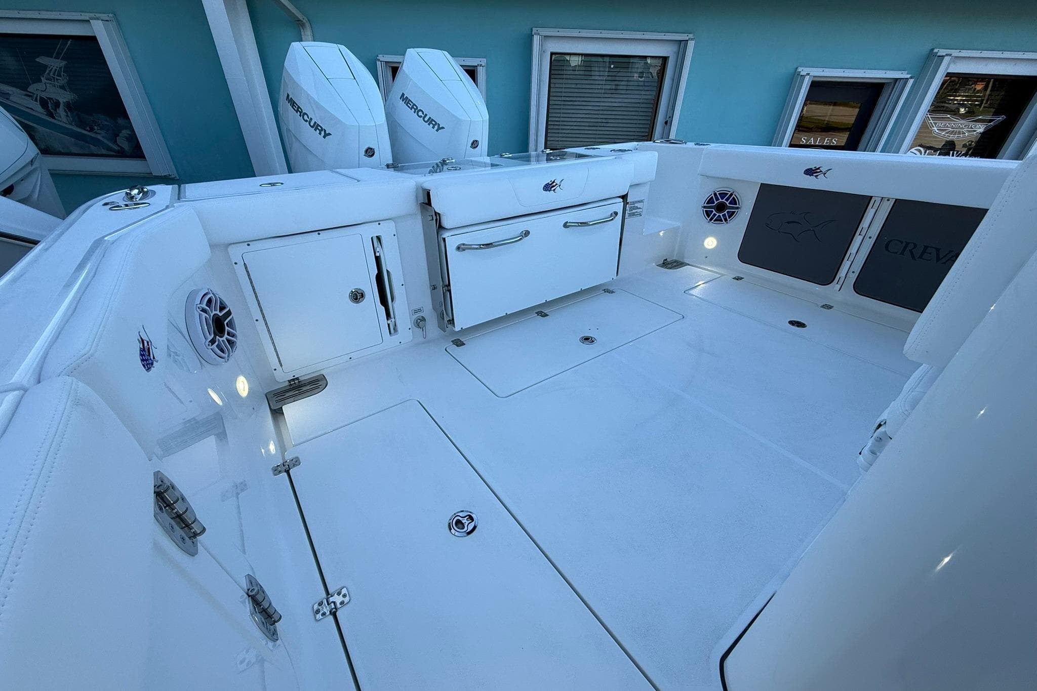 2026 Crevalle 33 CSF boat deck with storage, speakers, and Mercury engines.