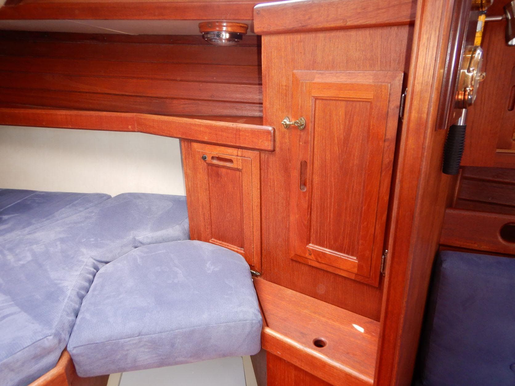Interior of a 1989 Ericson 38 - 200 yacht with wooden cabinetry.