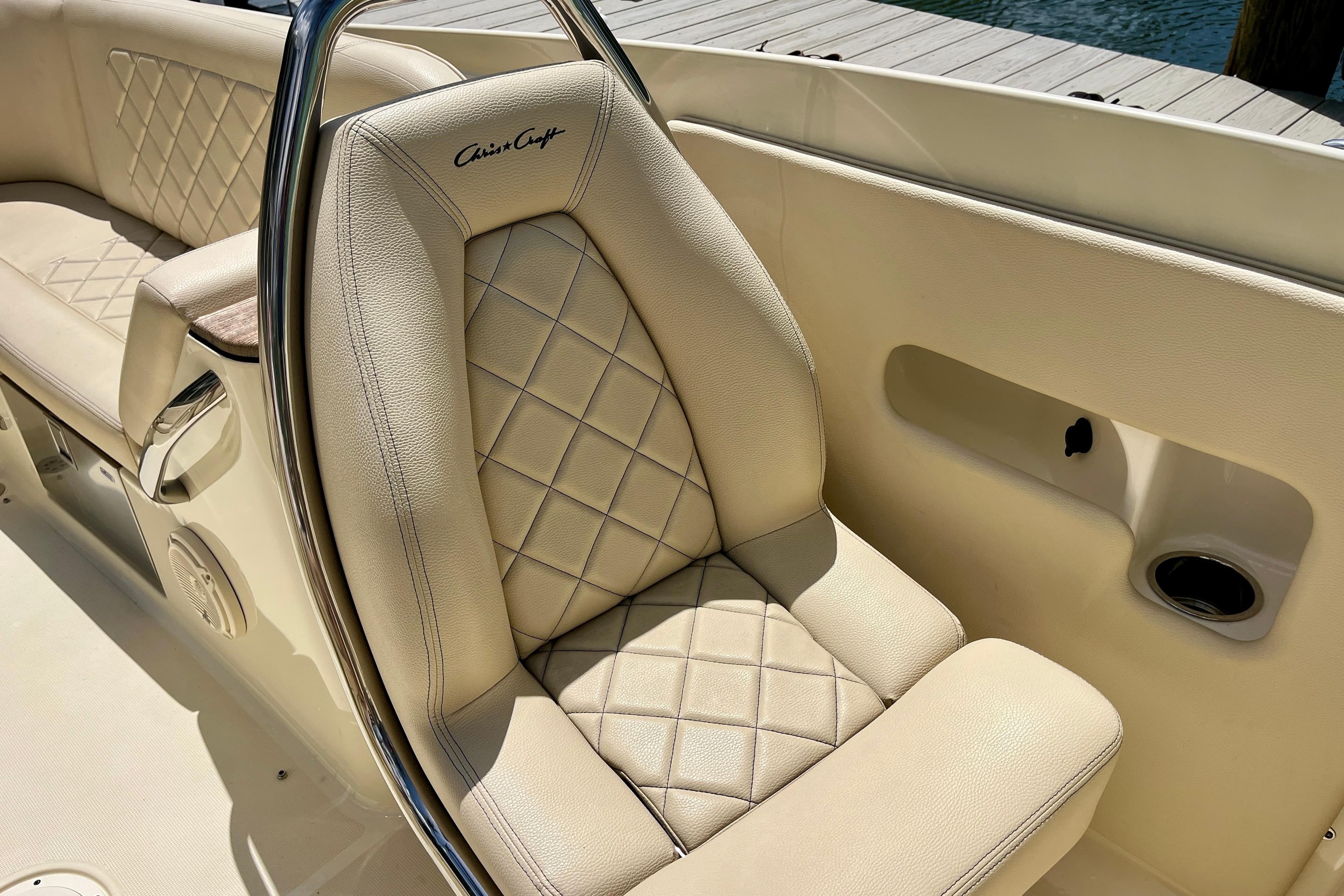 Luxurious interior of 2019 Chris-Craft Launch 27 boat with diamond-stitched leather seating.