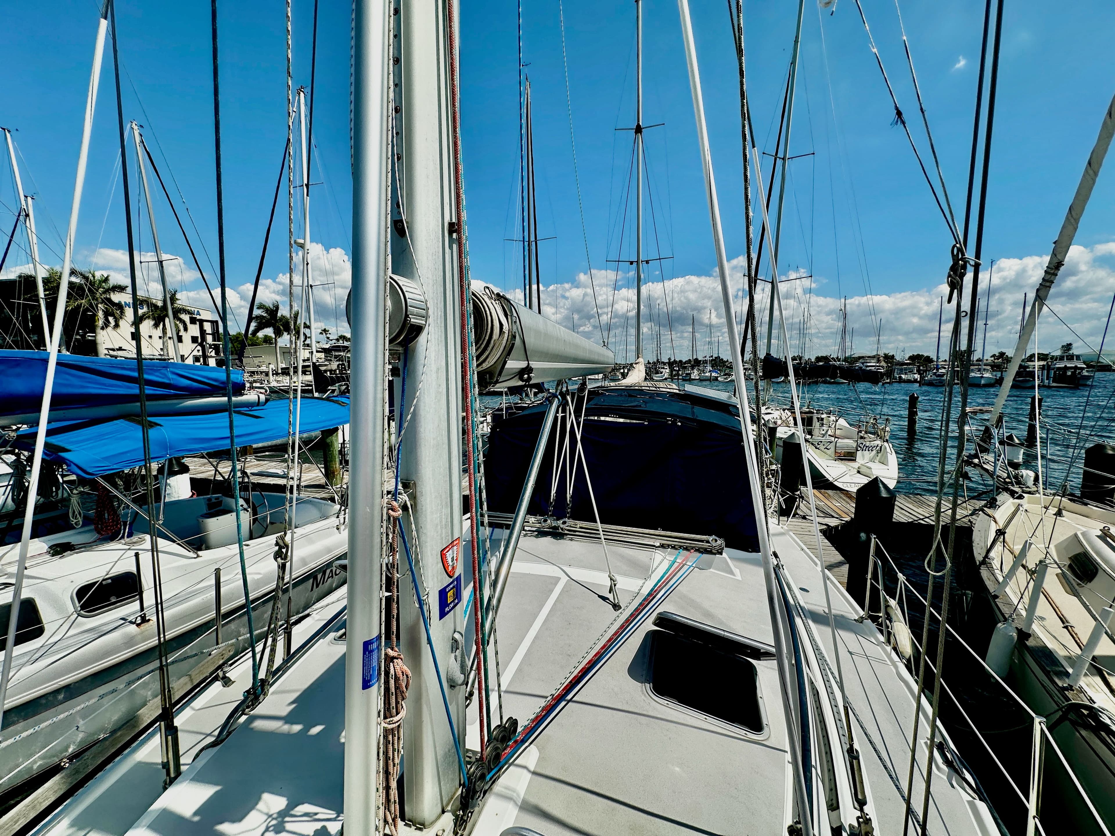 2005 Catalina 350 sailboat docked in sunny marina.