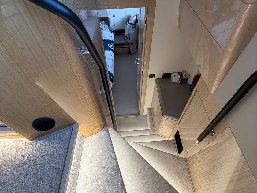 Staircase leading to cabin interior of 2021 Galeon 700 Sky yacht.