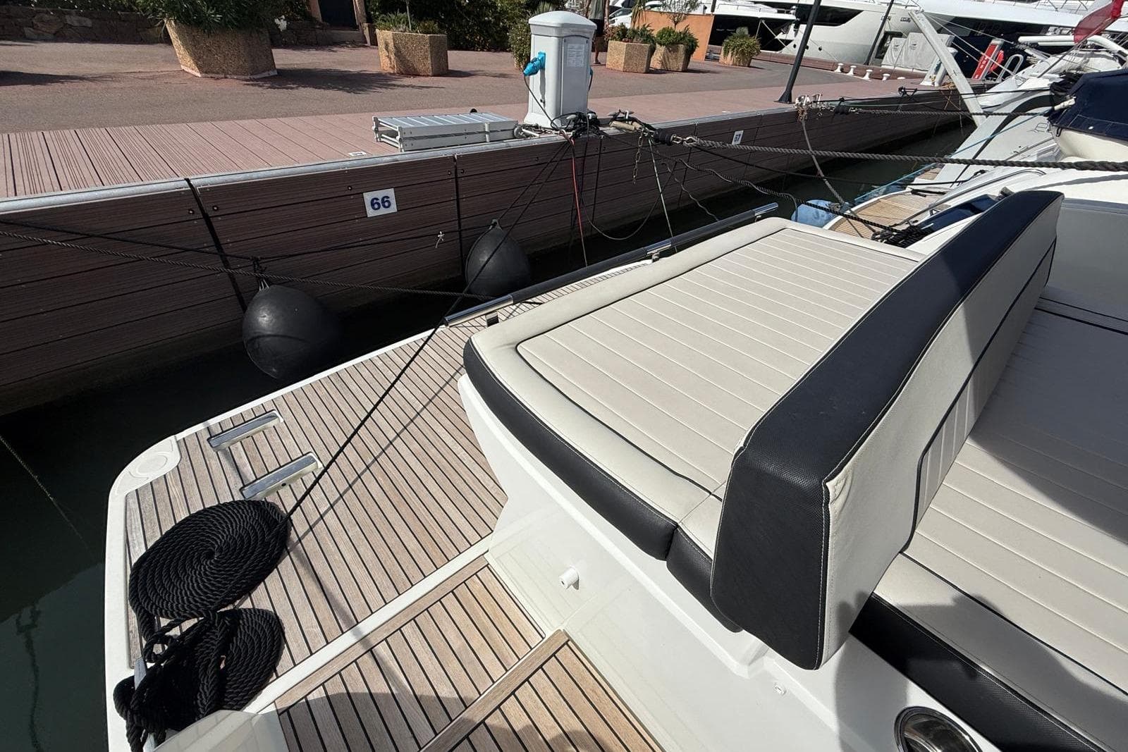 2020 Jeanneau Leader 36 yacht with sleek deck and comfortable seating at marina.