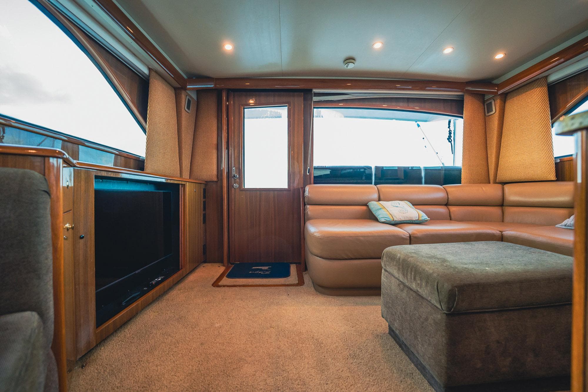 Luxurious interior of 2005 Viking 48 Convertible yacht with plush seating and modern amenities.