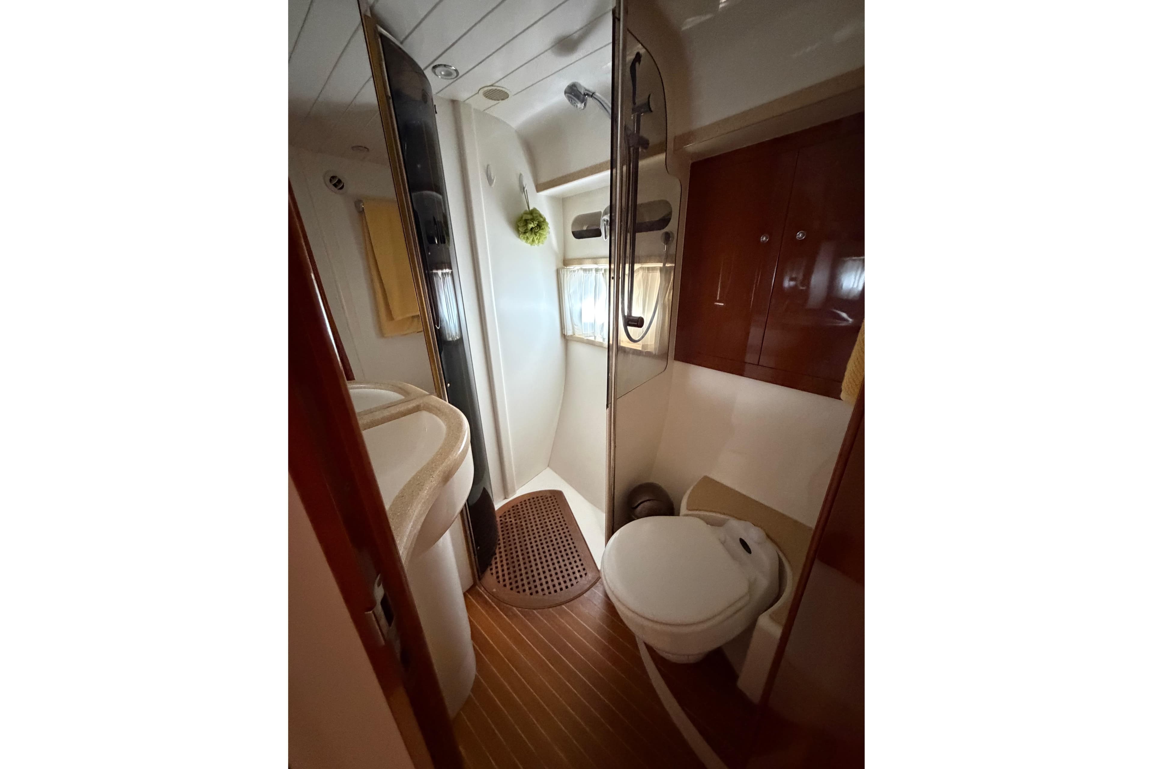 Bathroom interior of 2003 Viking Princess V50 yacht, featuring shower and toilet.