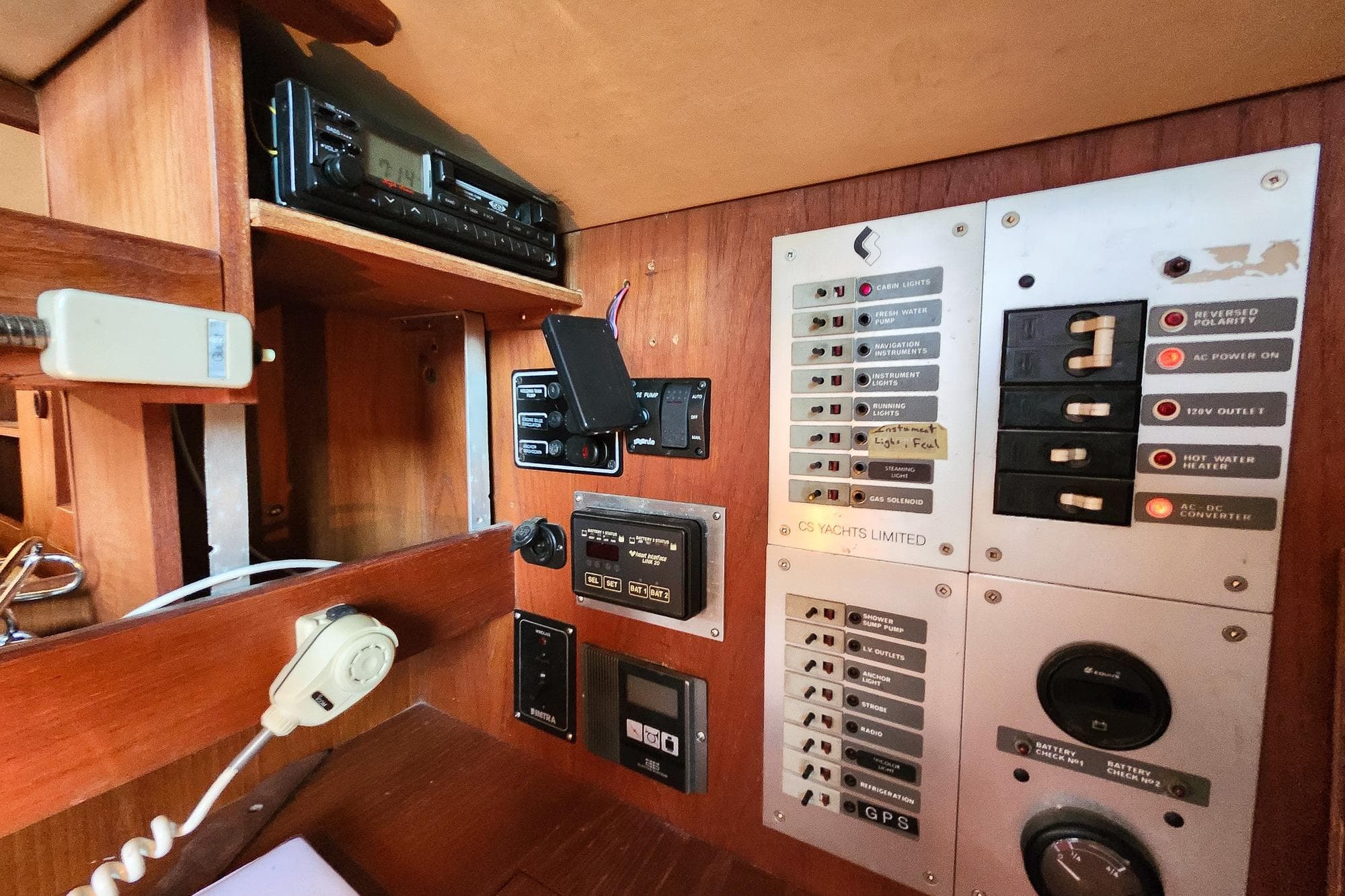 Control panel of a 1982 Canadian Sailcraft CS 36 yacht, featuring various switches and gauges.