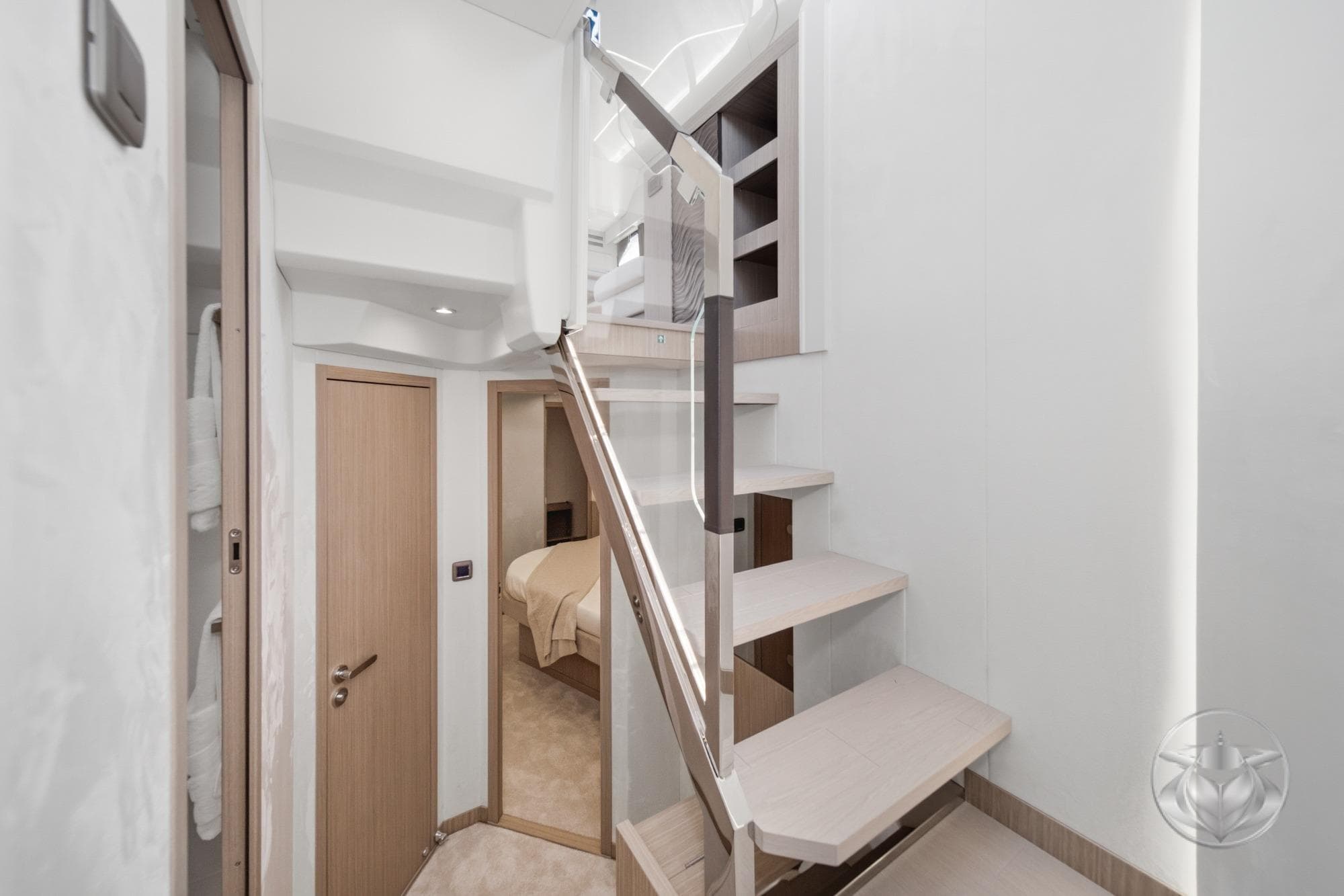 Modern interior of Prestige F5.7 yacht, featuring sleek staircase and minimalist design, 2026 model.