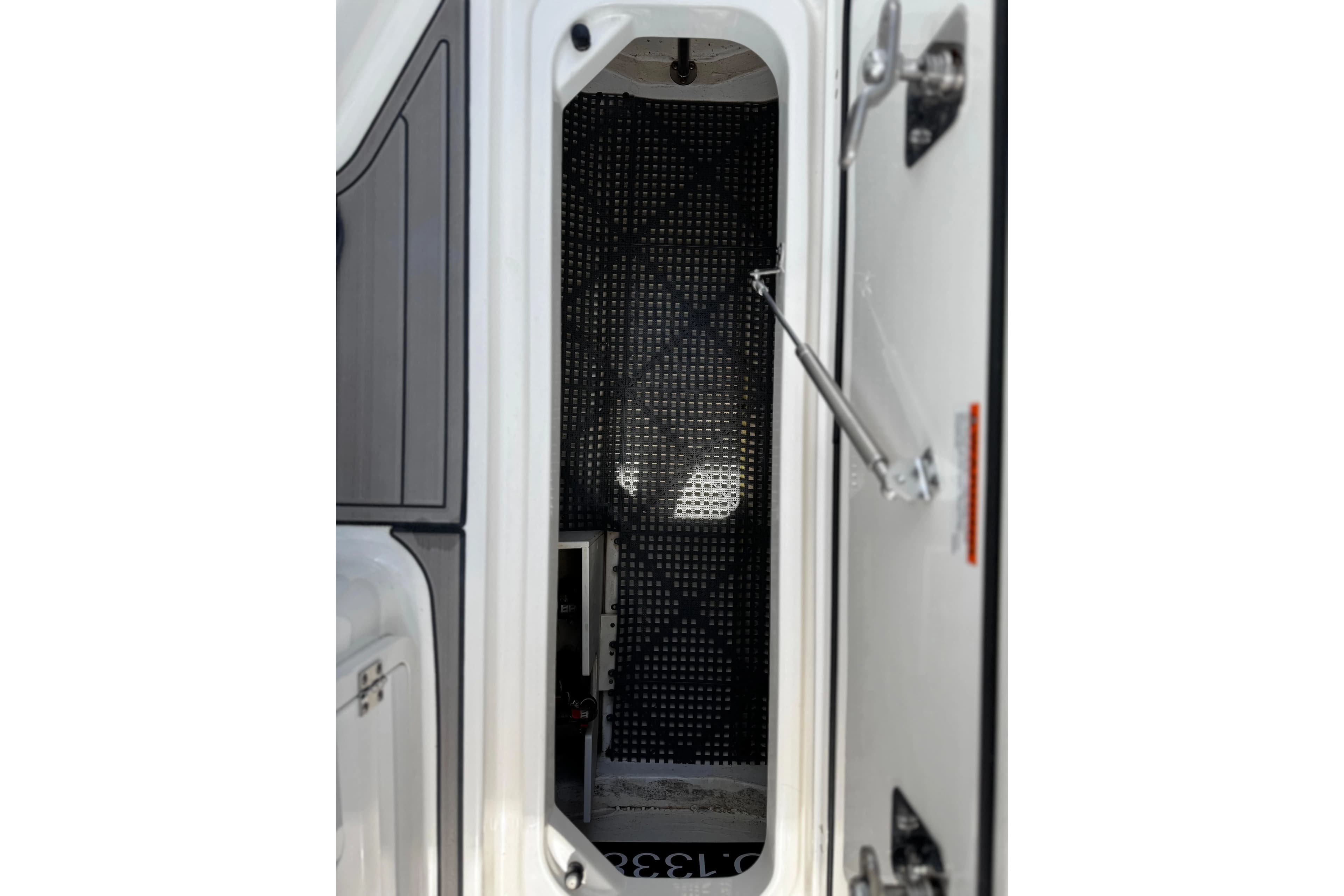 Interior of Pursuit DC 266 Dual Console 2023, open door view.