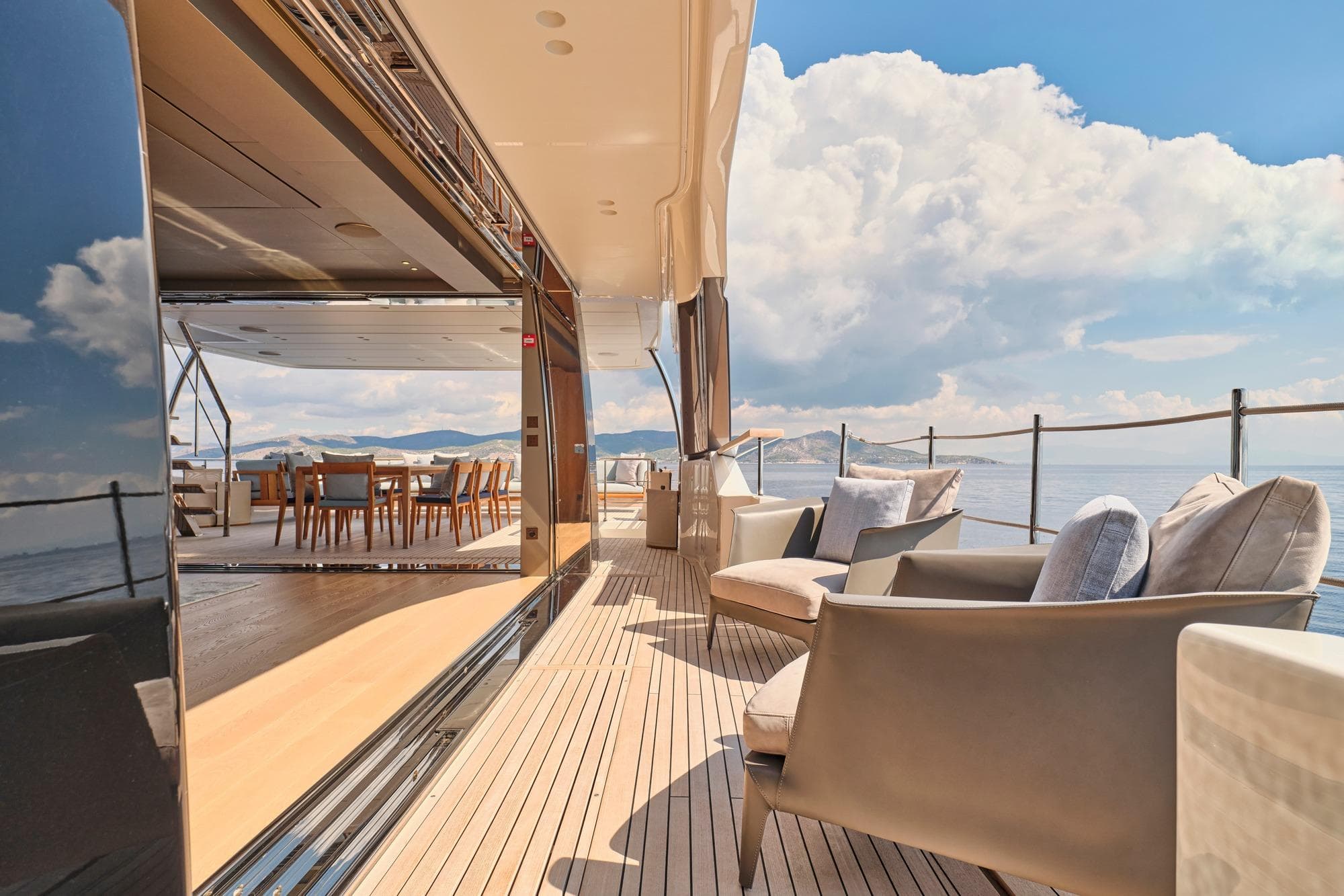 Luxurious 2024 Sanlorenzo SD118/156 yacht deck with elegant seating and ocean view.