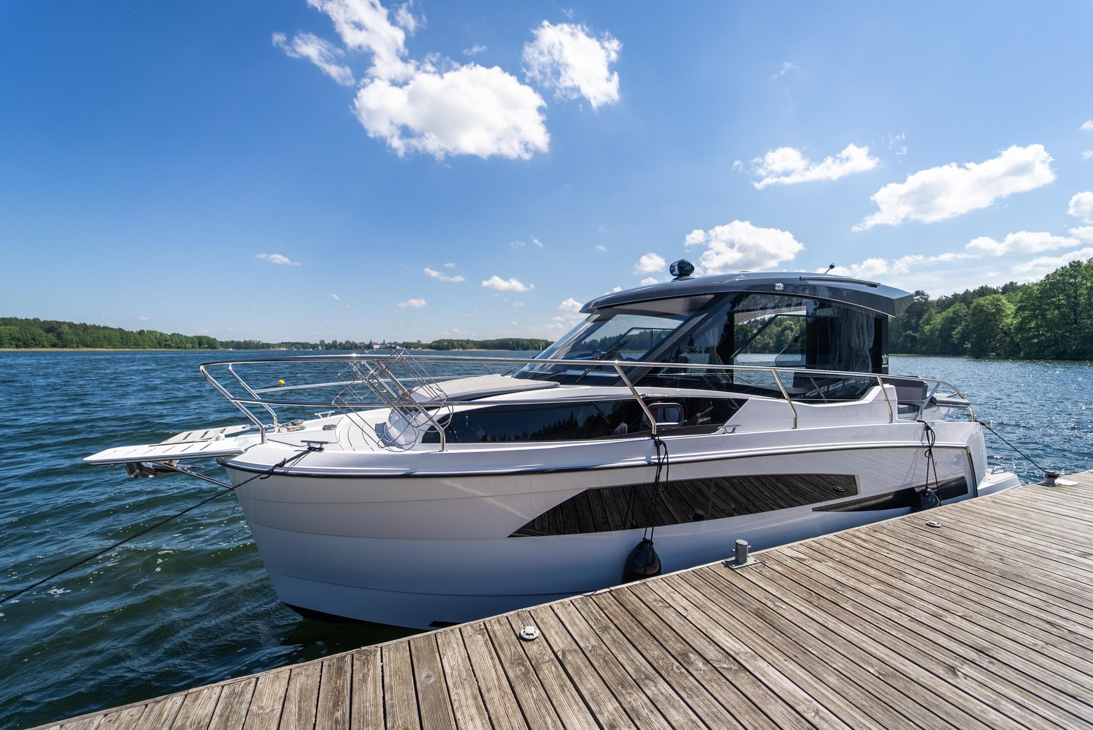 Modern Nautic 880 boat docked on a sunny day, 2025 model.