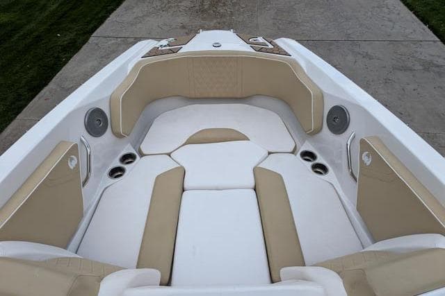 2017 Scarab 255 Platinum SE boat interior with beige and white seating.