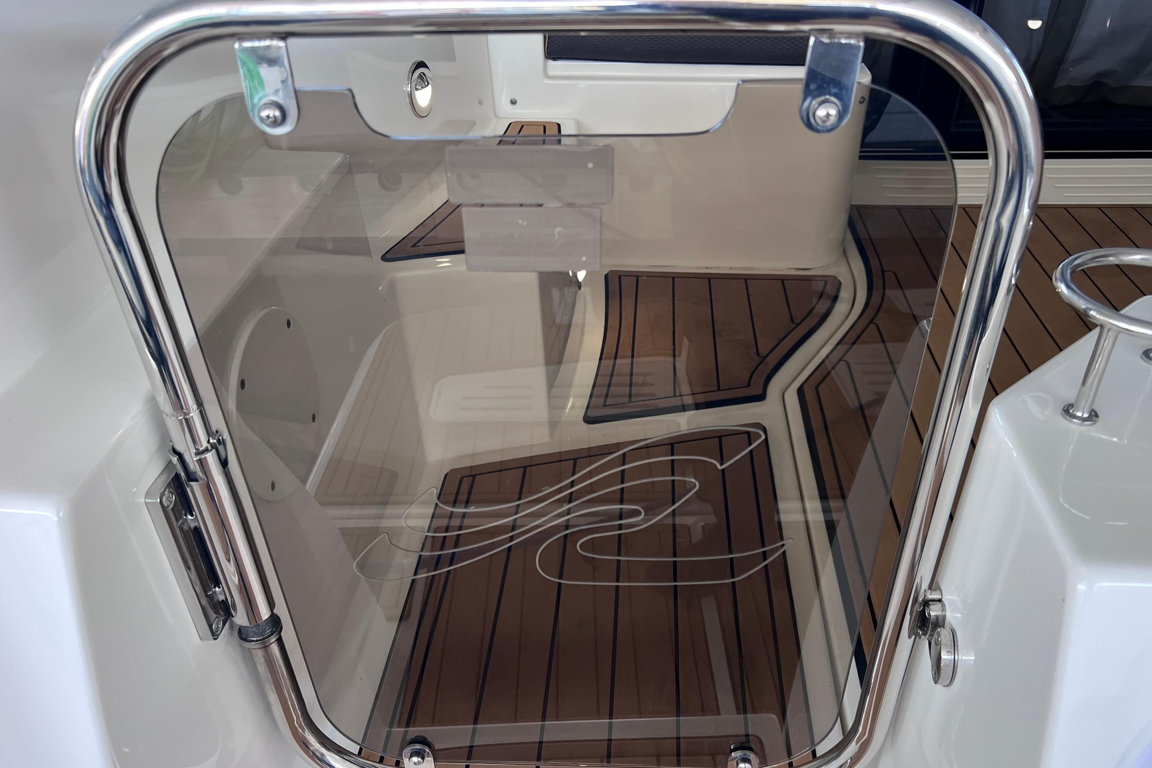 2017 Sea Ray Sundancer 400 yacht with sleek glass door and teak flooring.