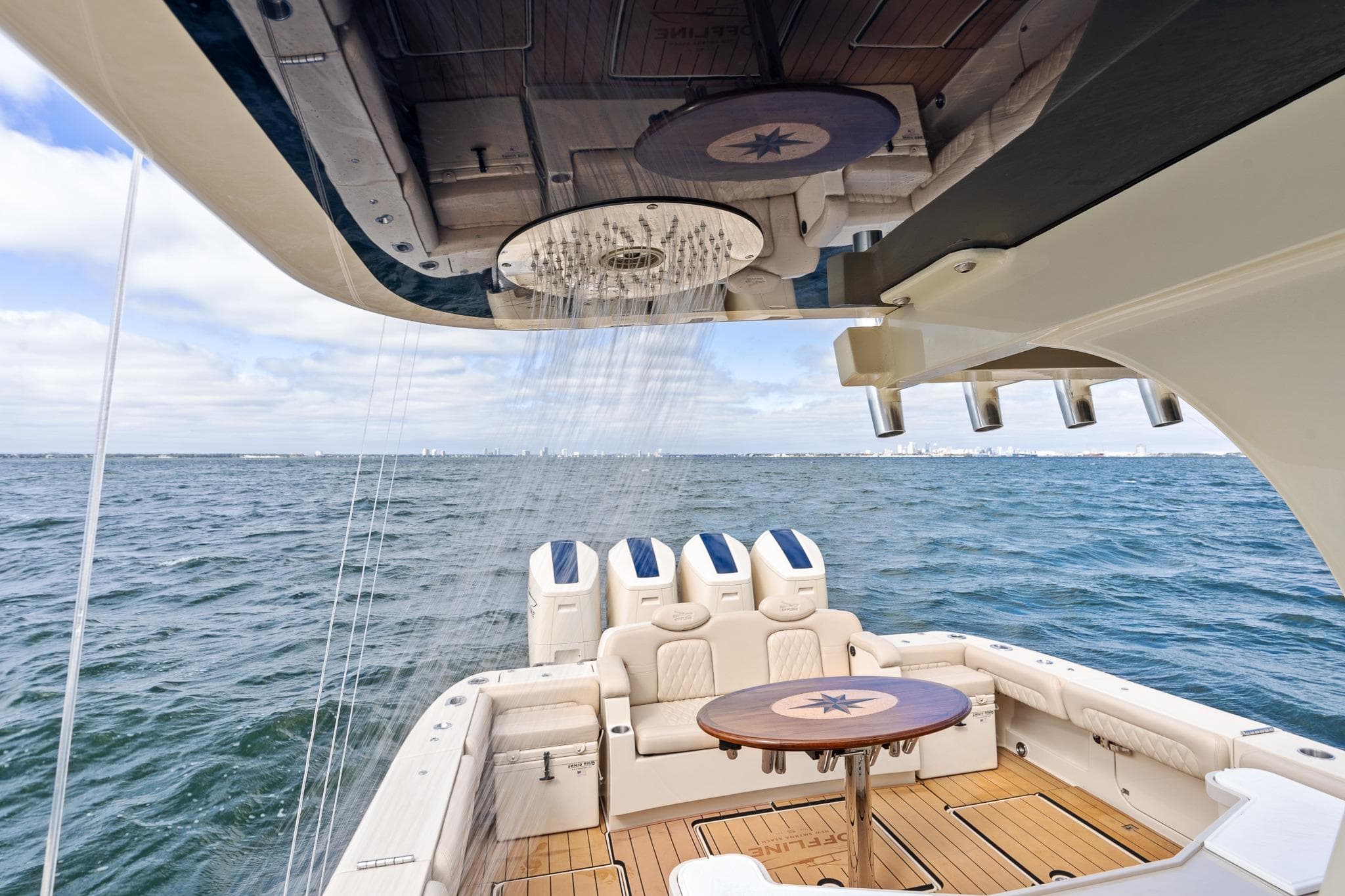 2023 HCB 53 Suenos RXV luxury boat with shower and seating on open water.
