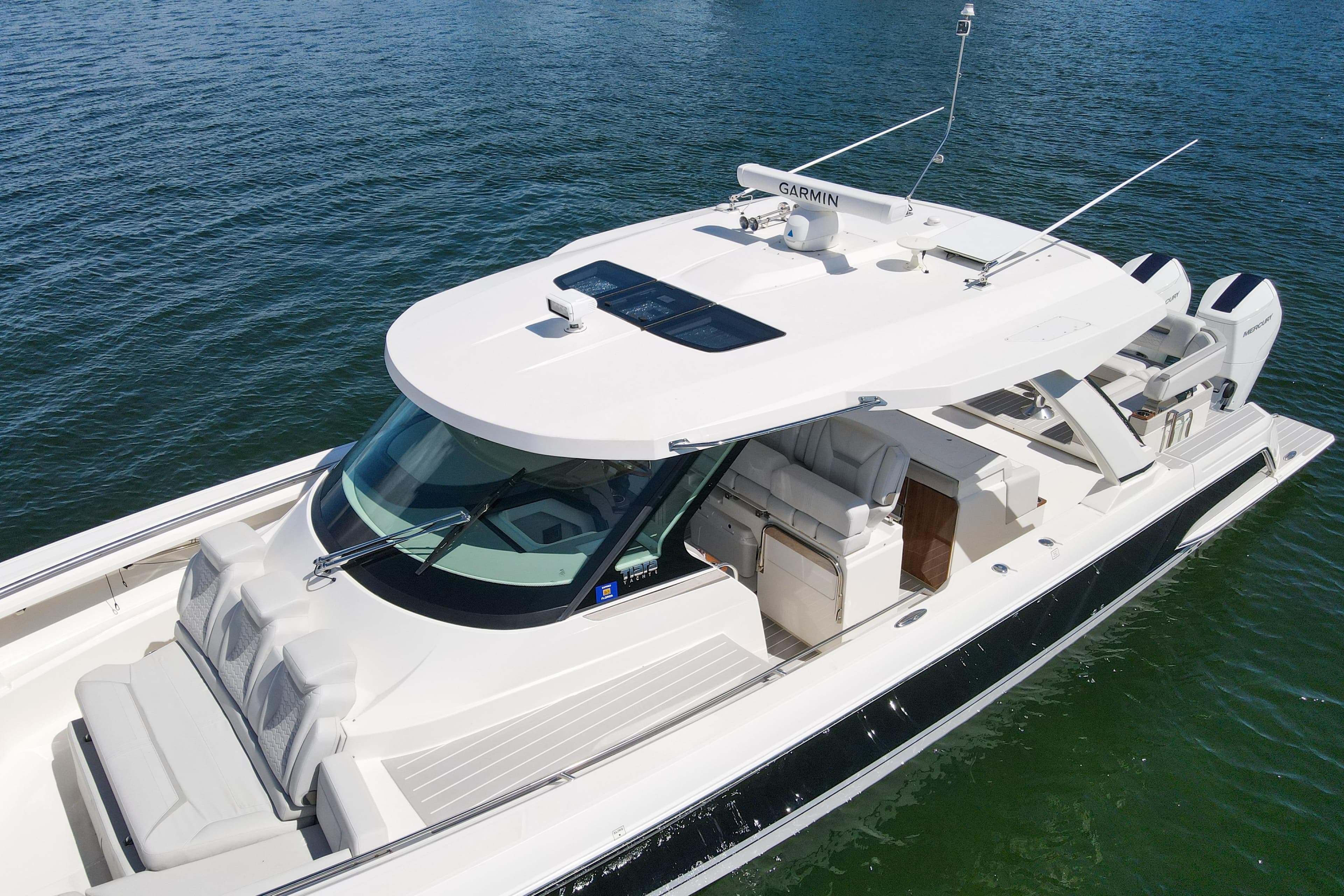 2024 Tiara Yachts 43 LS luxury boat on water, featuring sleek design and modern amenities.