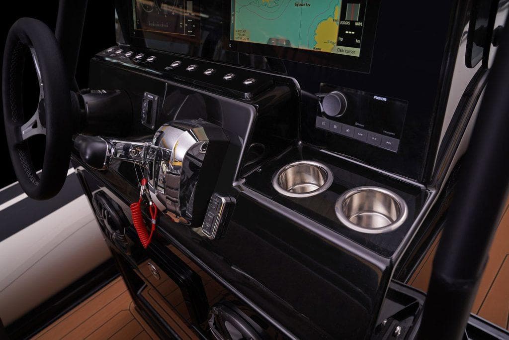 Control panel of 2026 Brig Navigator 22 boat with steering wheel and navigation display.