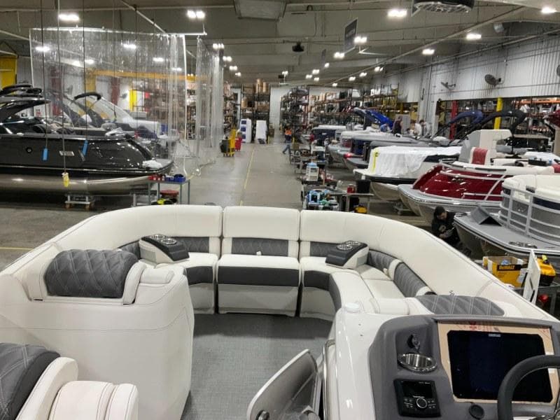 2024 Bennington 27QXSBA-T2 luxury boat interior in a manufacturing facility.