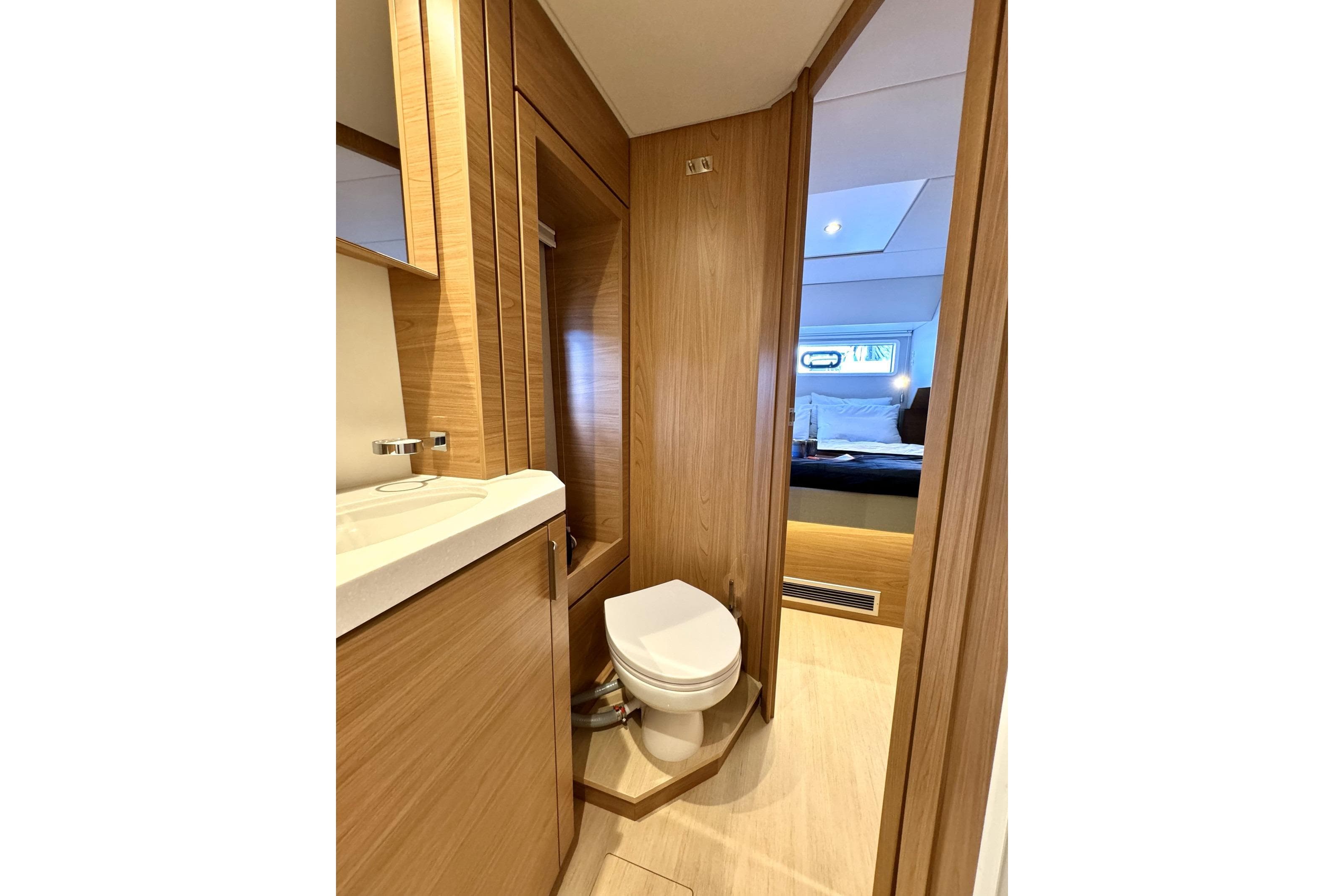Luxurious 2024 Bali 4.6 yacht bathroom with modern wood finish and sleek design.