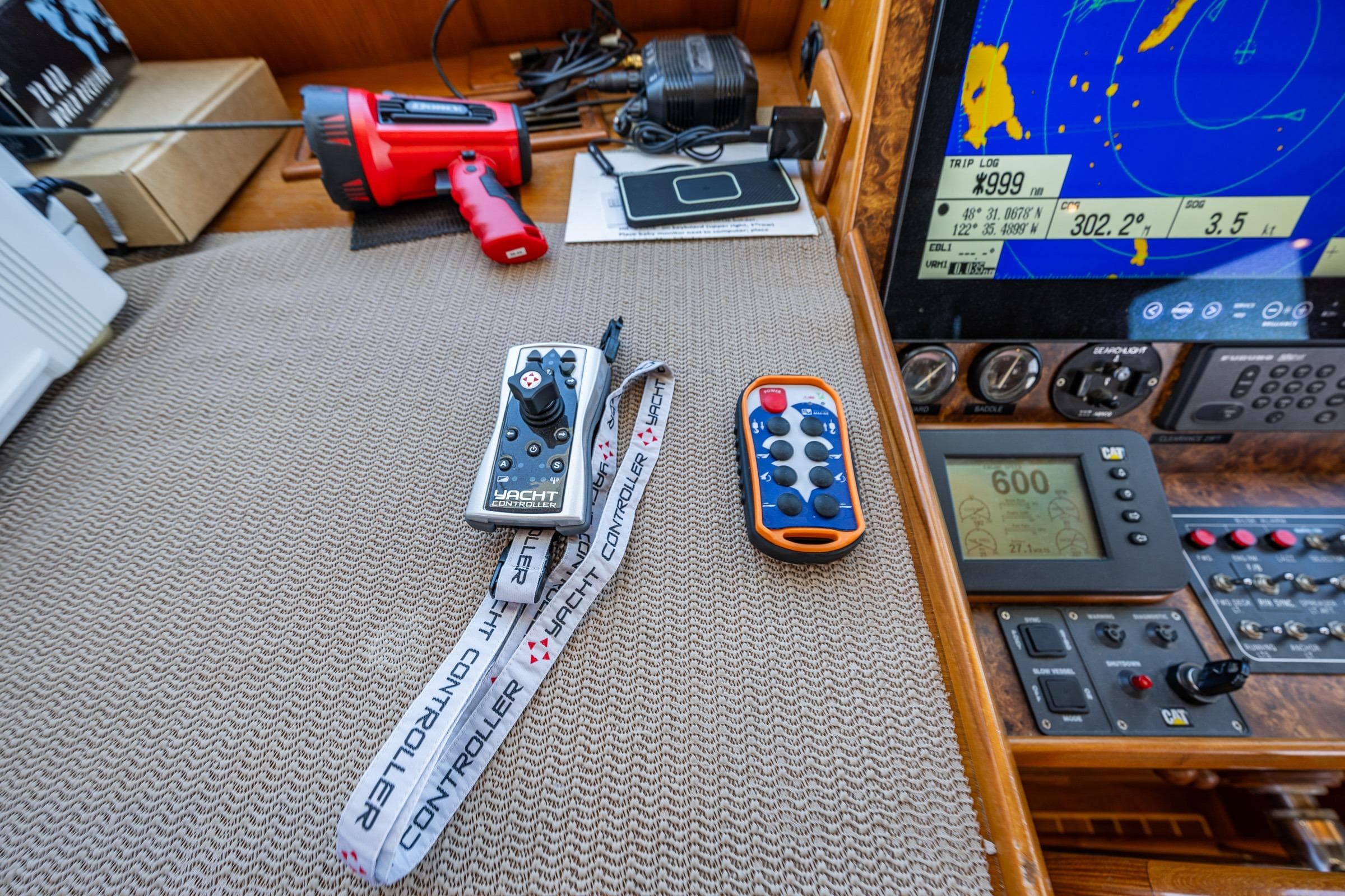 Yacht control panel with remote controllers on a 2007 DeFever 56.