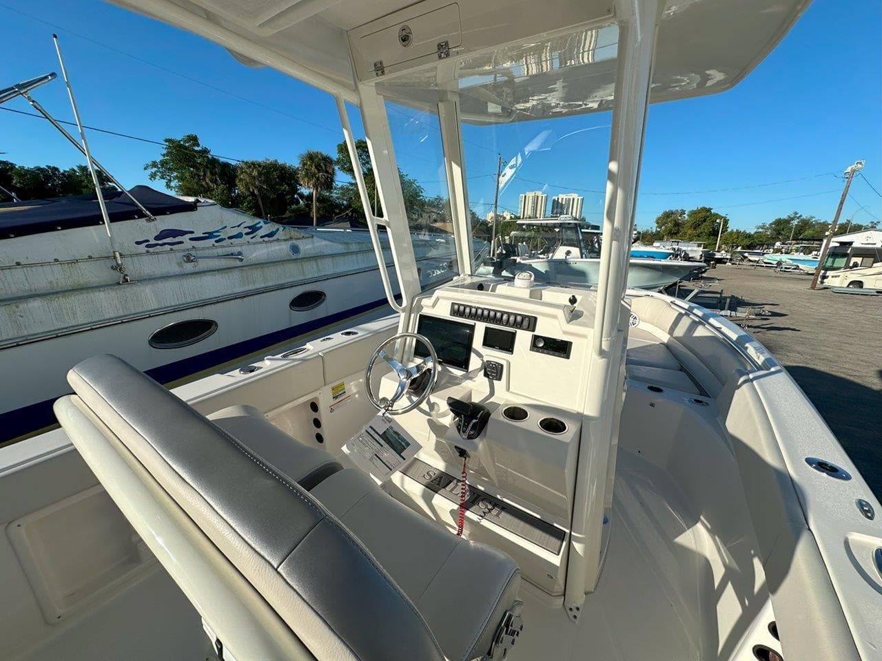 2025 Sailfish 232 boat interior with steering wheel and control panel.