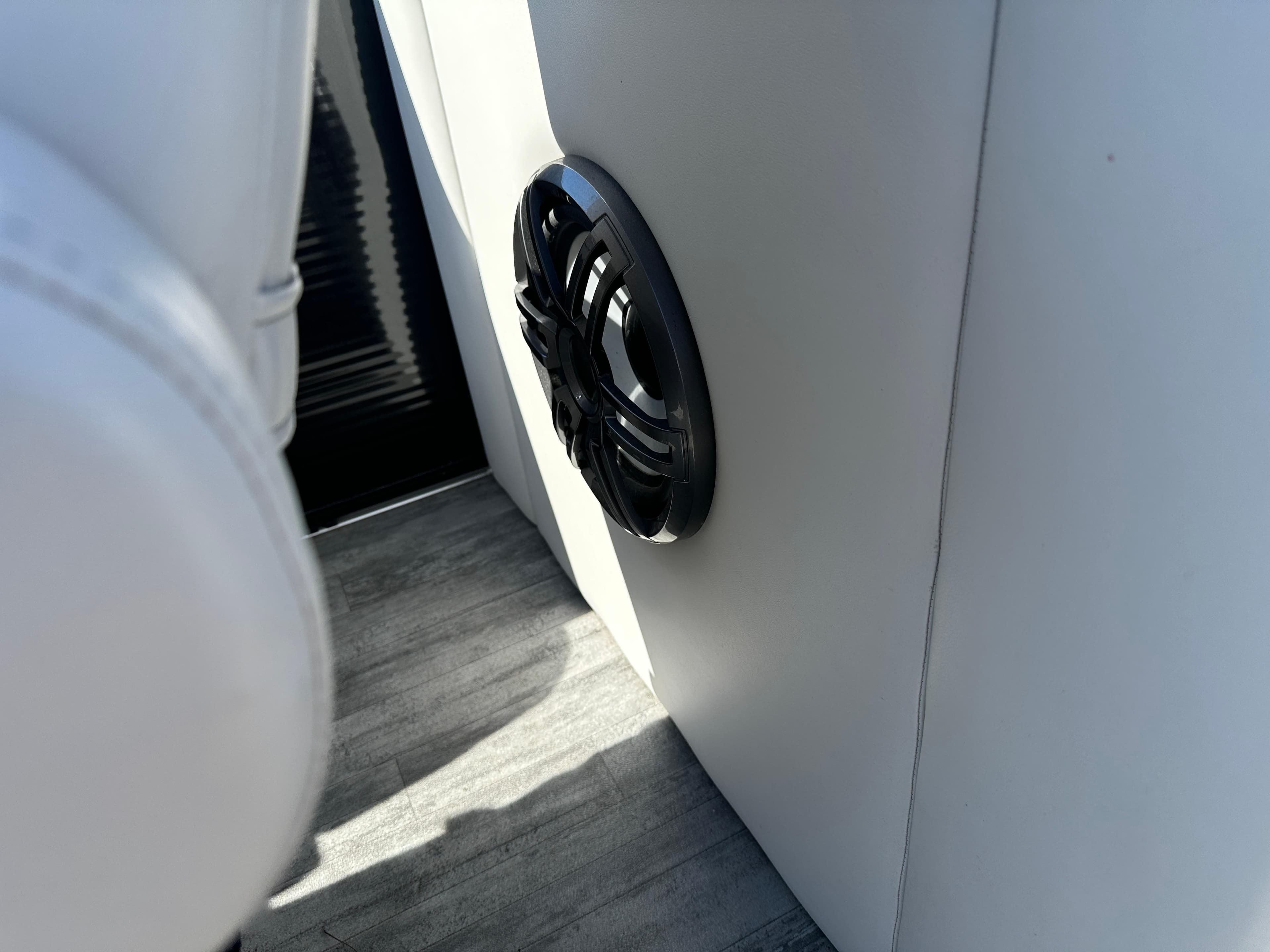 Speaker on a 2022 Crest Classic DLX SLRC 220 boat interior, featuring sleek design and modern upholstery.