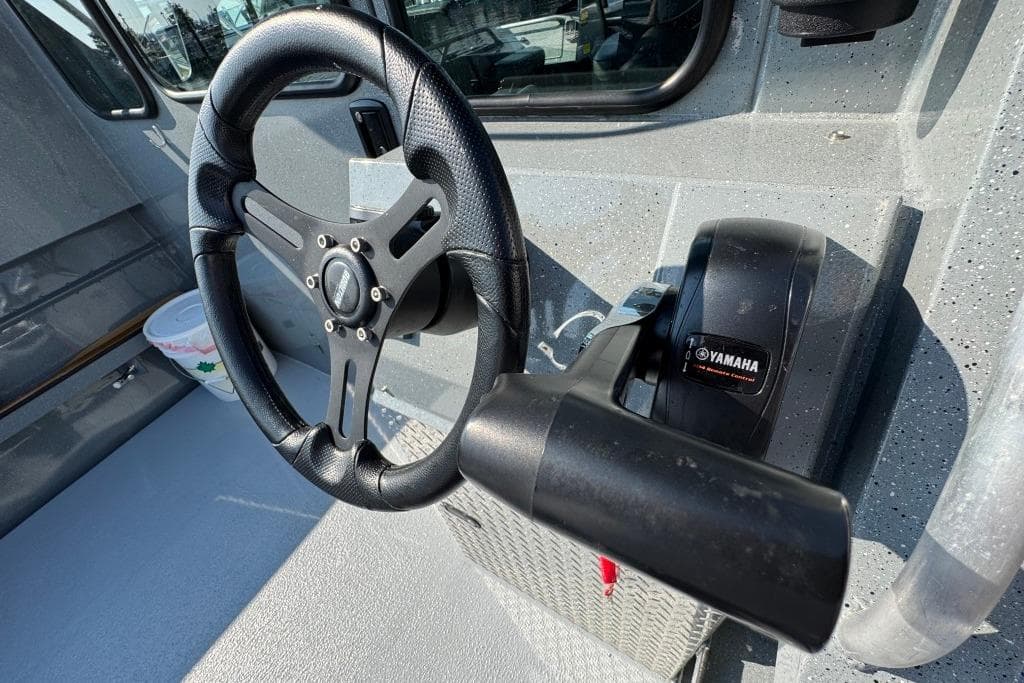 Steering wheel and controls of 2023 Boulton VOYAGER PRO boat with Yamaha throttle.