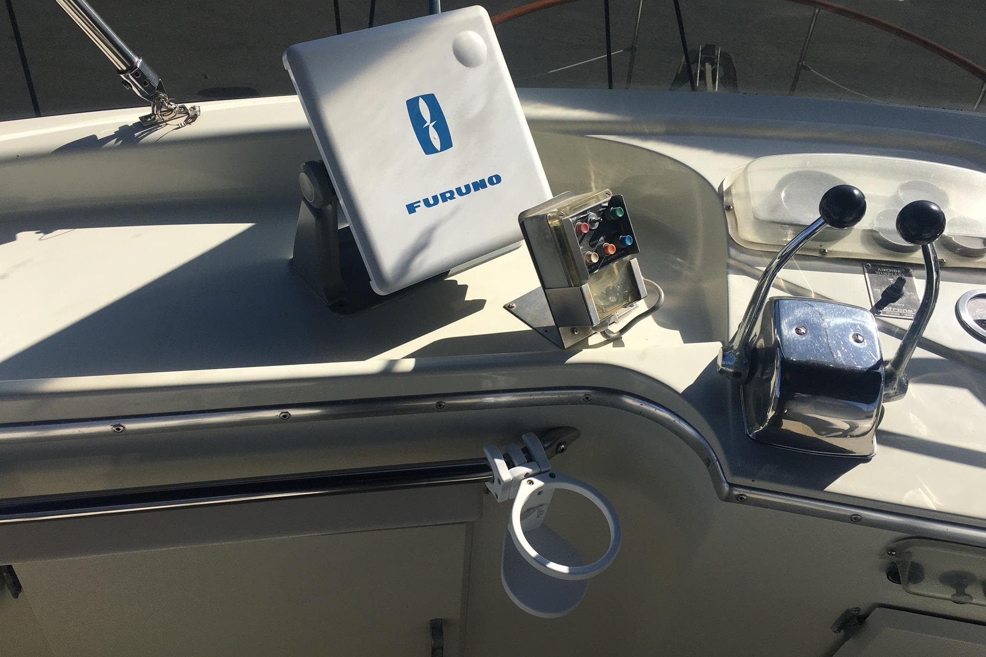 1978 Tollycraft 40 Tri-Cabin MY helm with Furuno navigation and dual throttle controls.