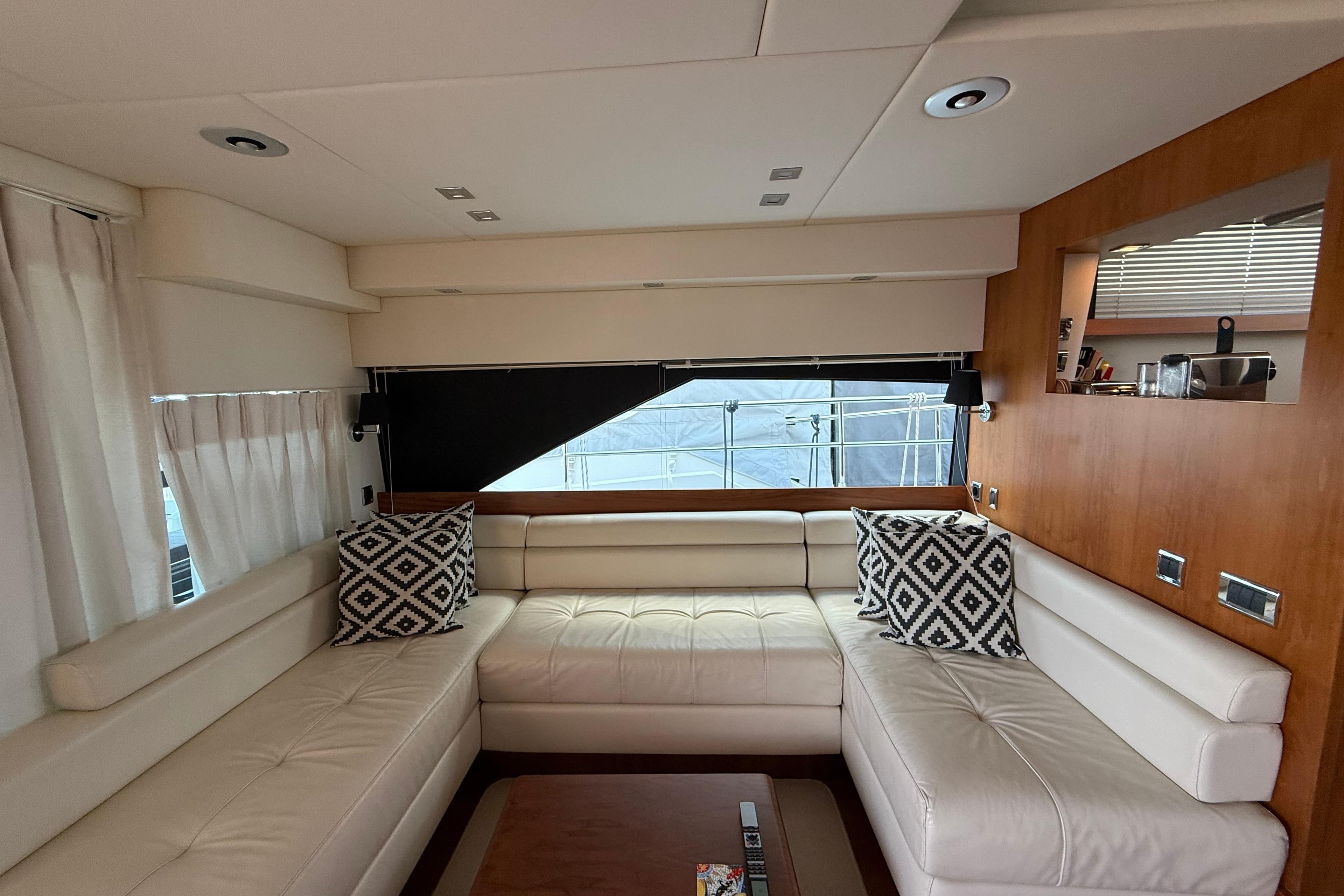 Luxurious interior of 2012 Fairline Squadron 58 yacht with white leather seating.