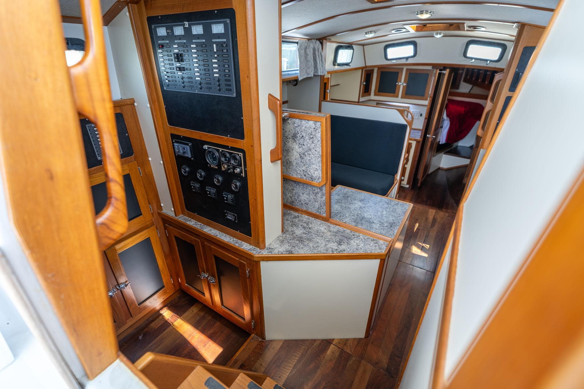 Interior of a 1978 Cascade High Side boat with wood paneling and control panels.