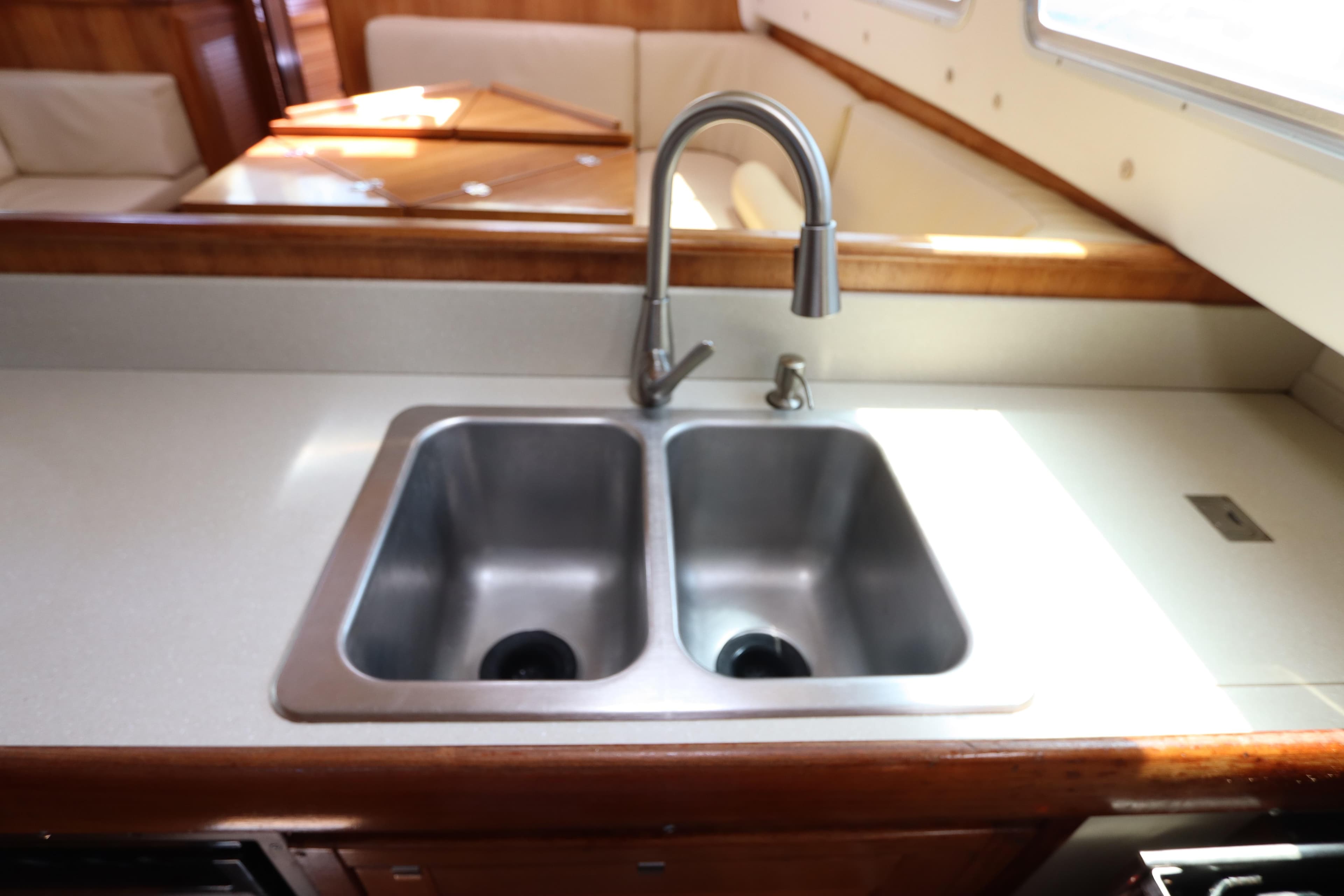 Galley sink in 2007 Catalina Morgan 440 yacht, featuring dual basins and modern faucet.
