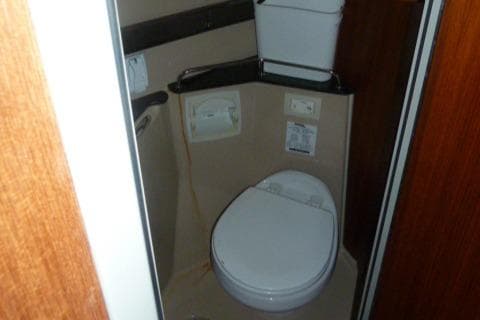 2013 Ranger Tugs R-31 boat bathroom interior with toilet and storage.