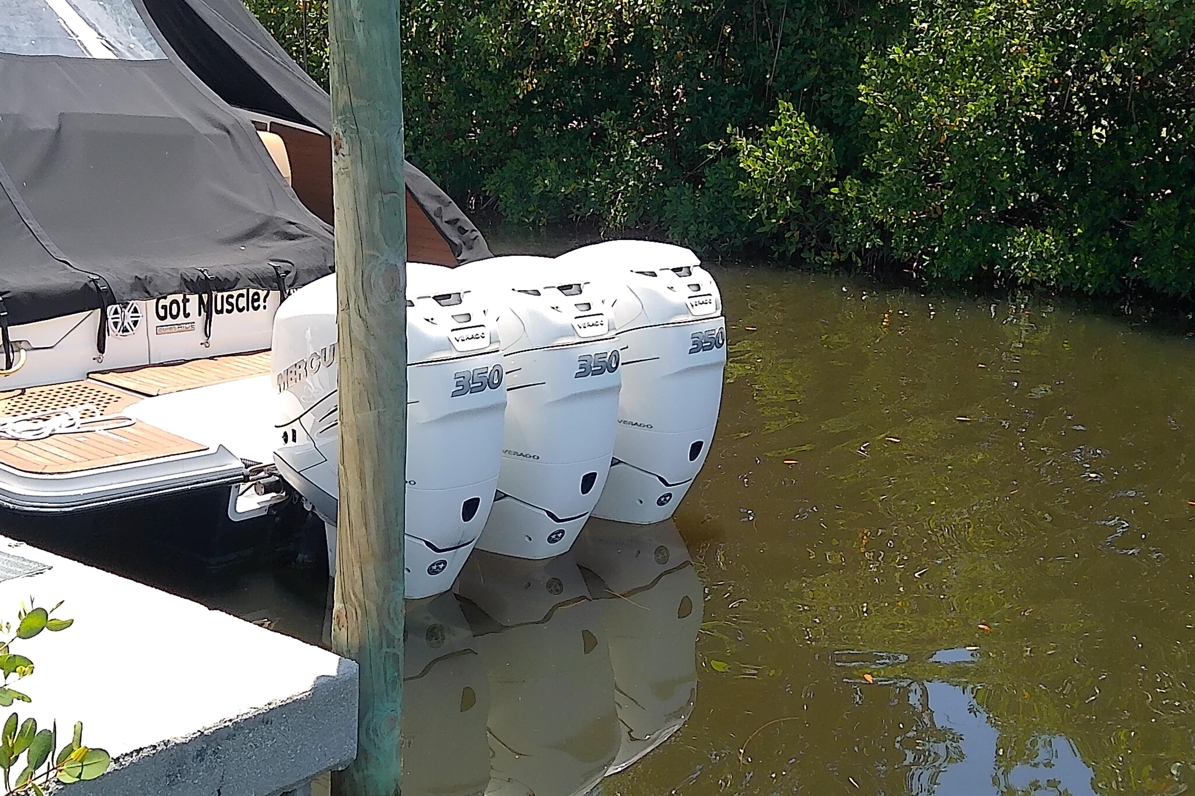 2019 Sea Ray SLX 400 Outboard with triple Mercury 350 engines docked in water.