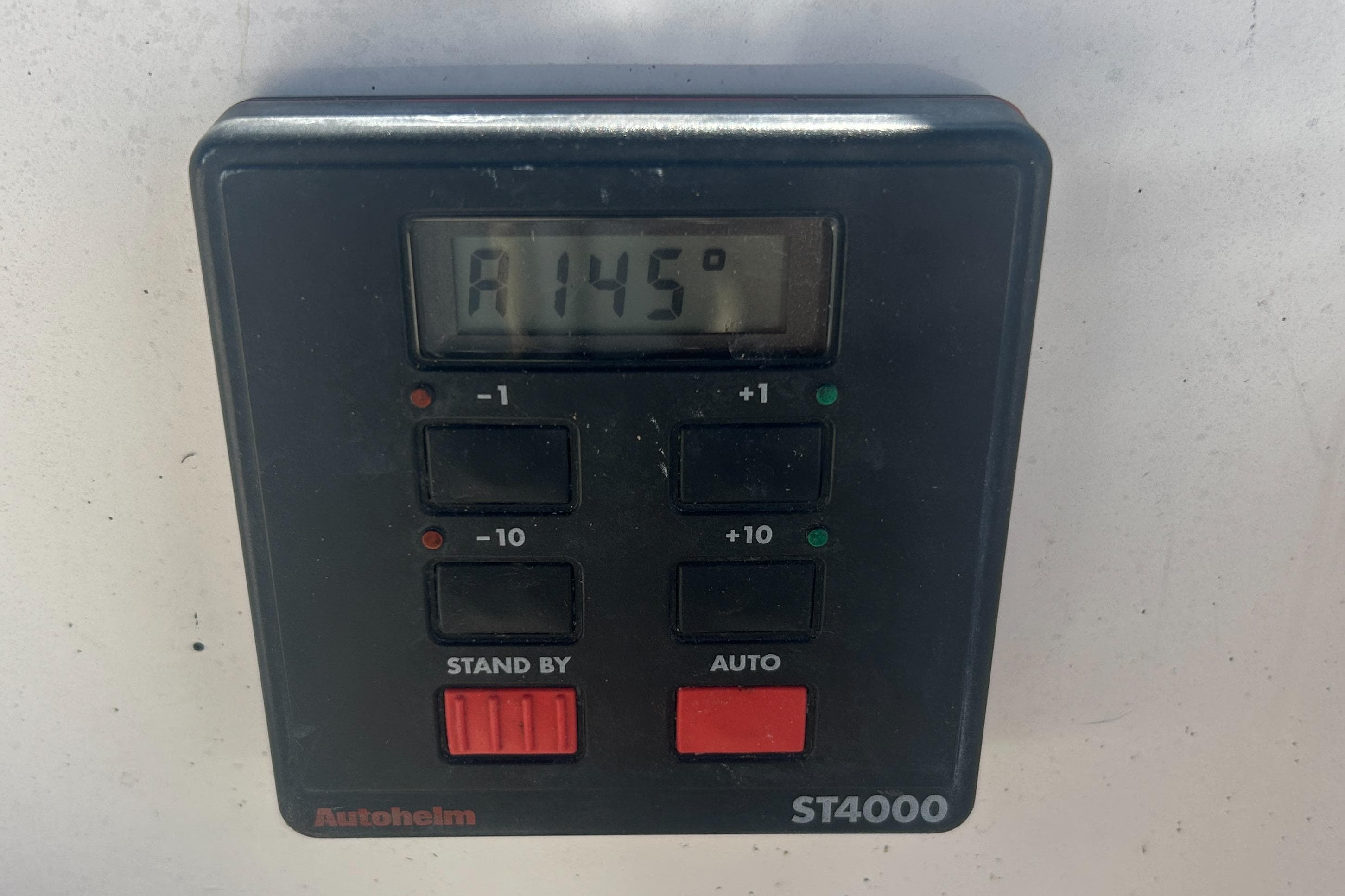 Autopilot control panel, Autohelm ST4000, displaying 145 degrees, on a 1998 Tartan 3500.