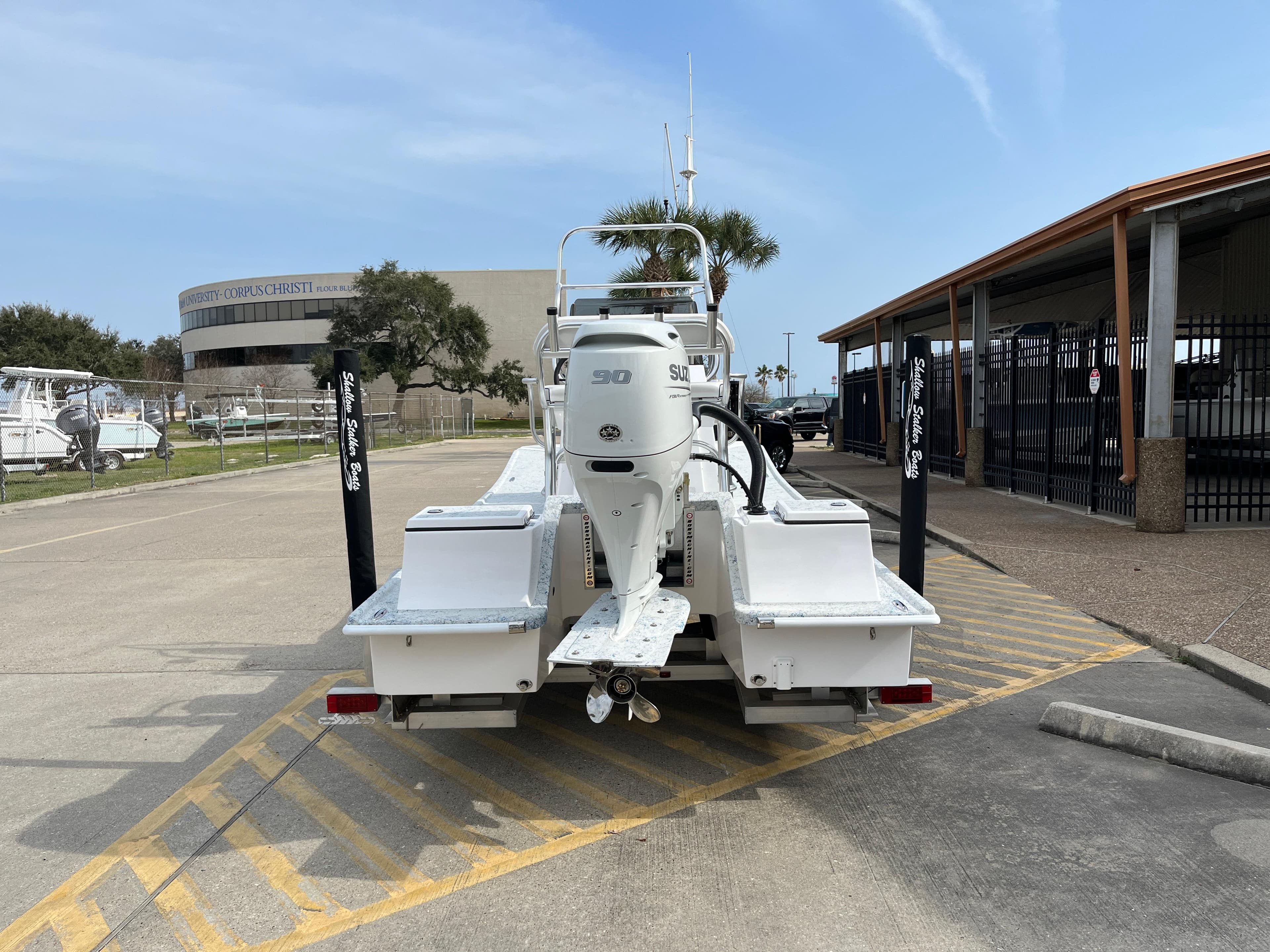 2024 Shallow Stalker SS-17 Sportsman boat with 90 HP engine at marina.